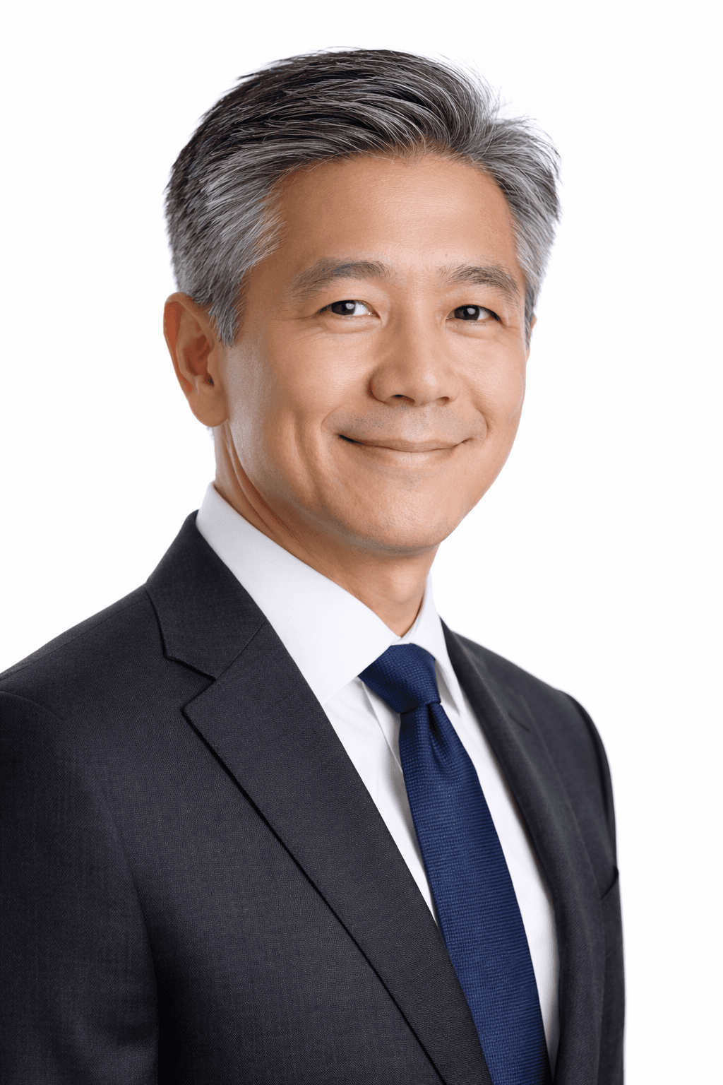 a man with a goatee smiles at the camera