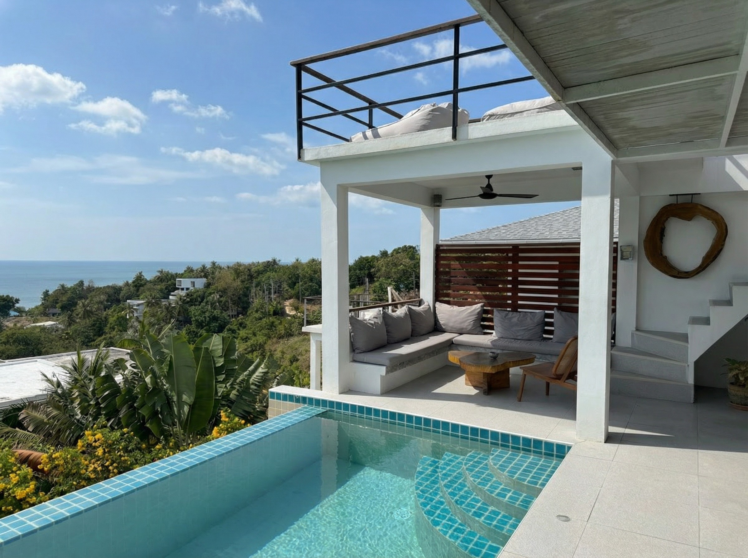 wide aerial view of a coastal mediterranean modern villa