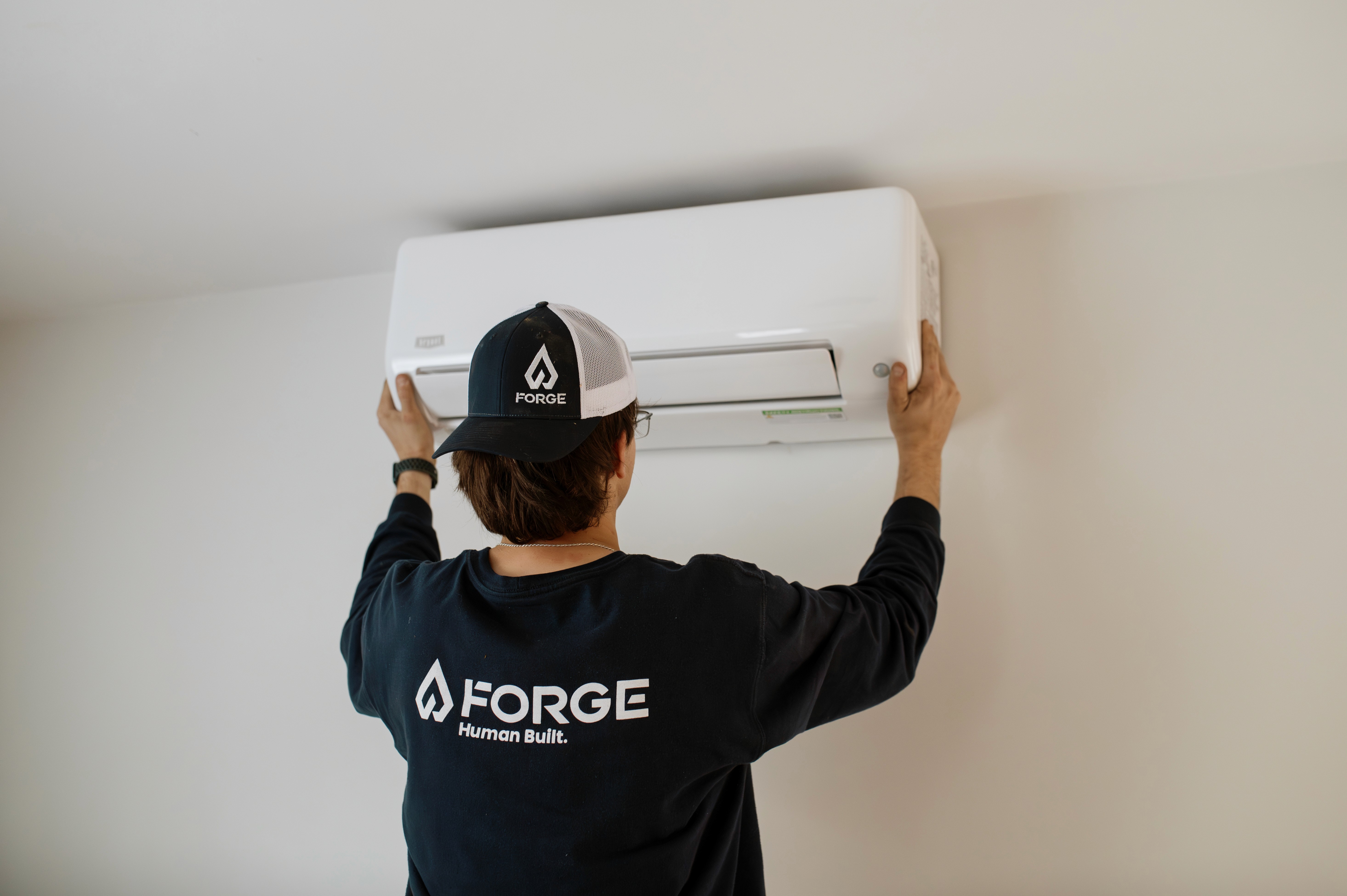 Forge team installing a unit