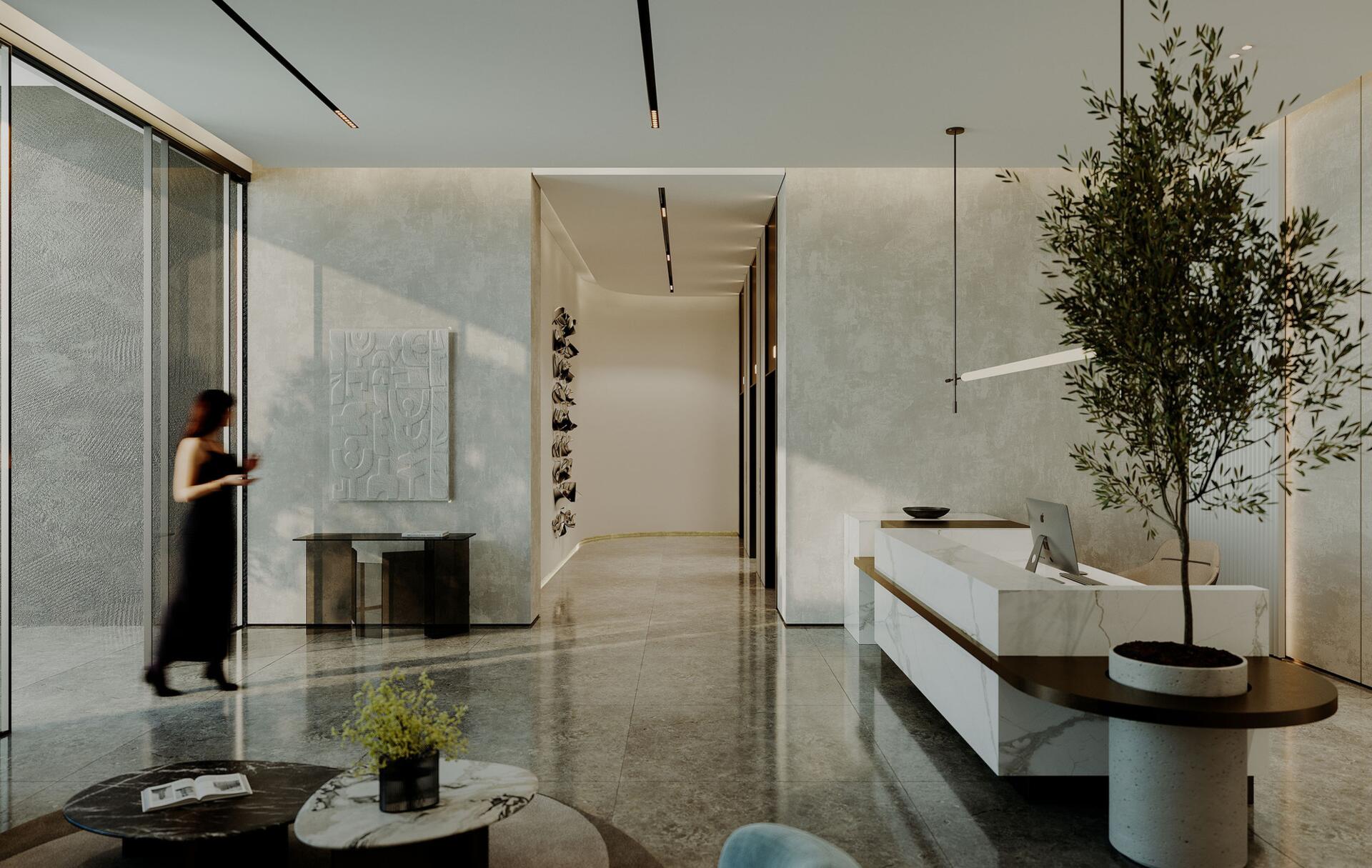 A modern office interior featuring a reception desk and chairs, labeled as Norah Residence.