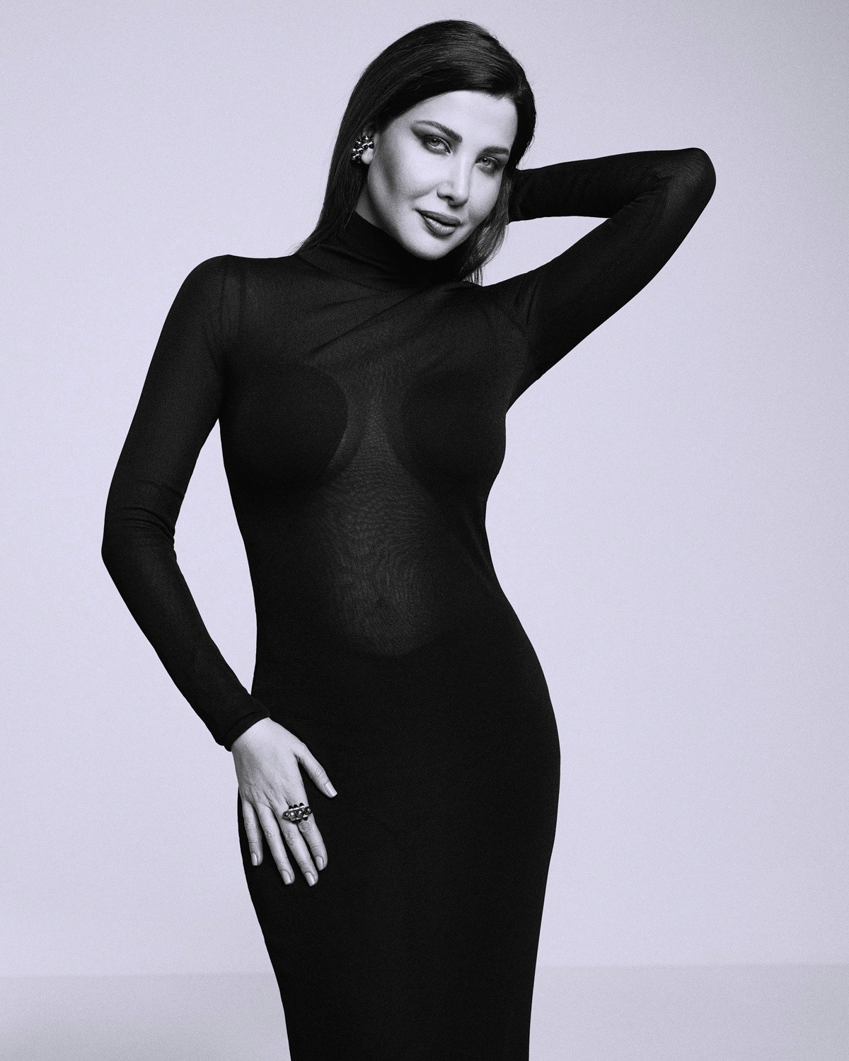 Nancy Ajram in Alaïa dress and Cartier jewelry