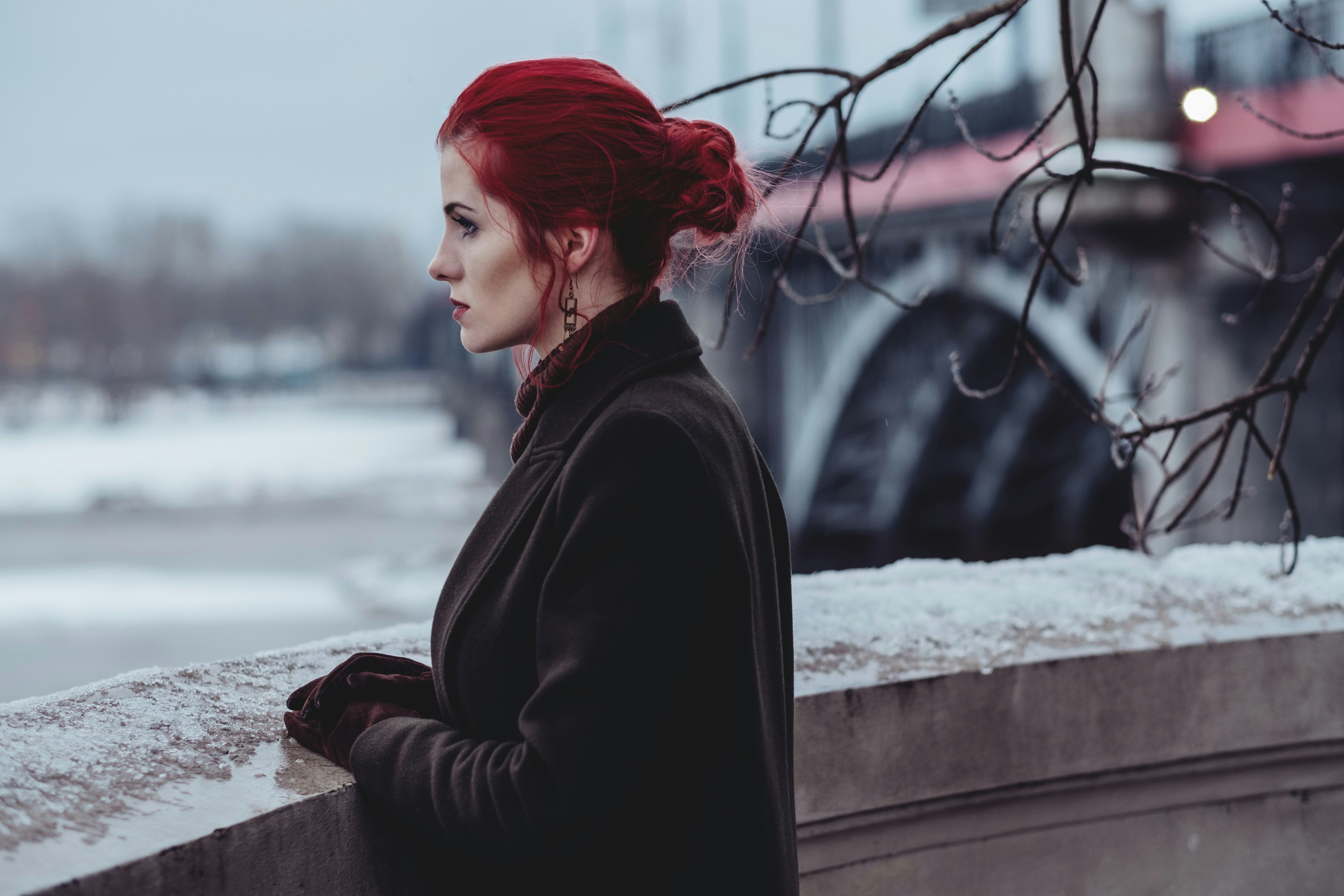 Redhead Girl Watching Snow - Best Colors for Winter Skin Tone