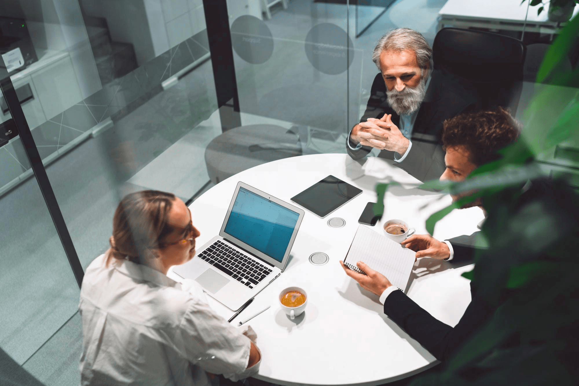 Product team meeting around a table to scope a fintech MVP
