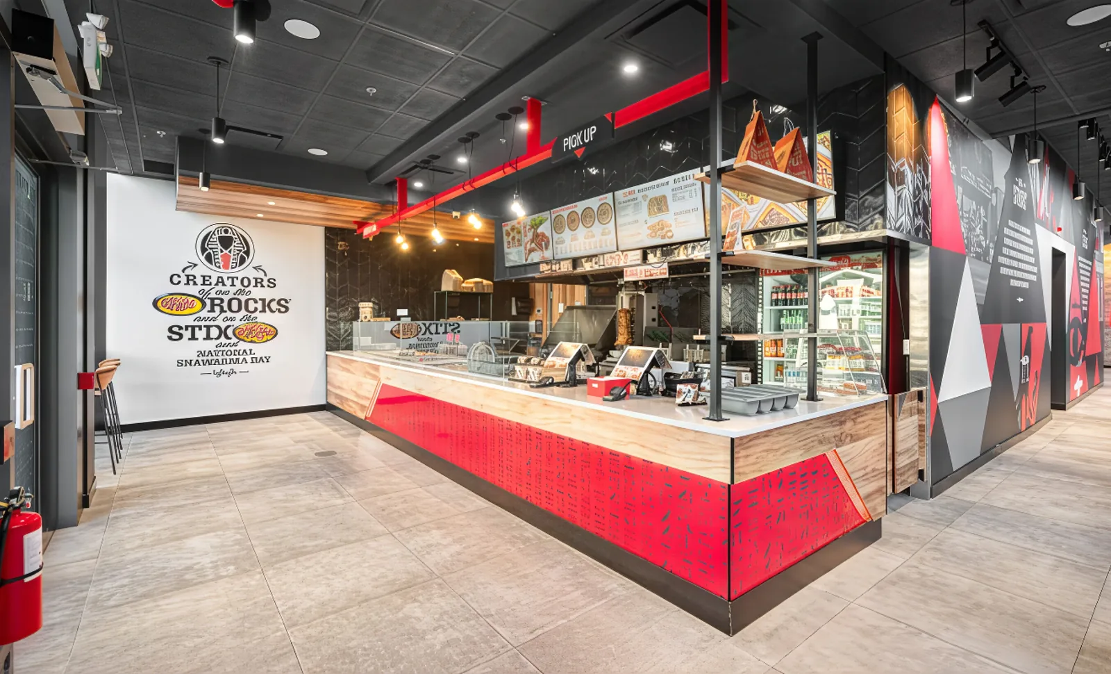 Interior of an Osmow's restaurant location with modern red and black decor
