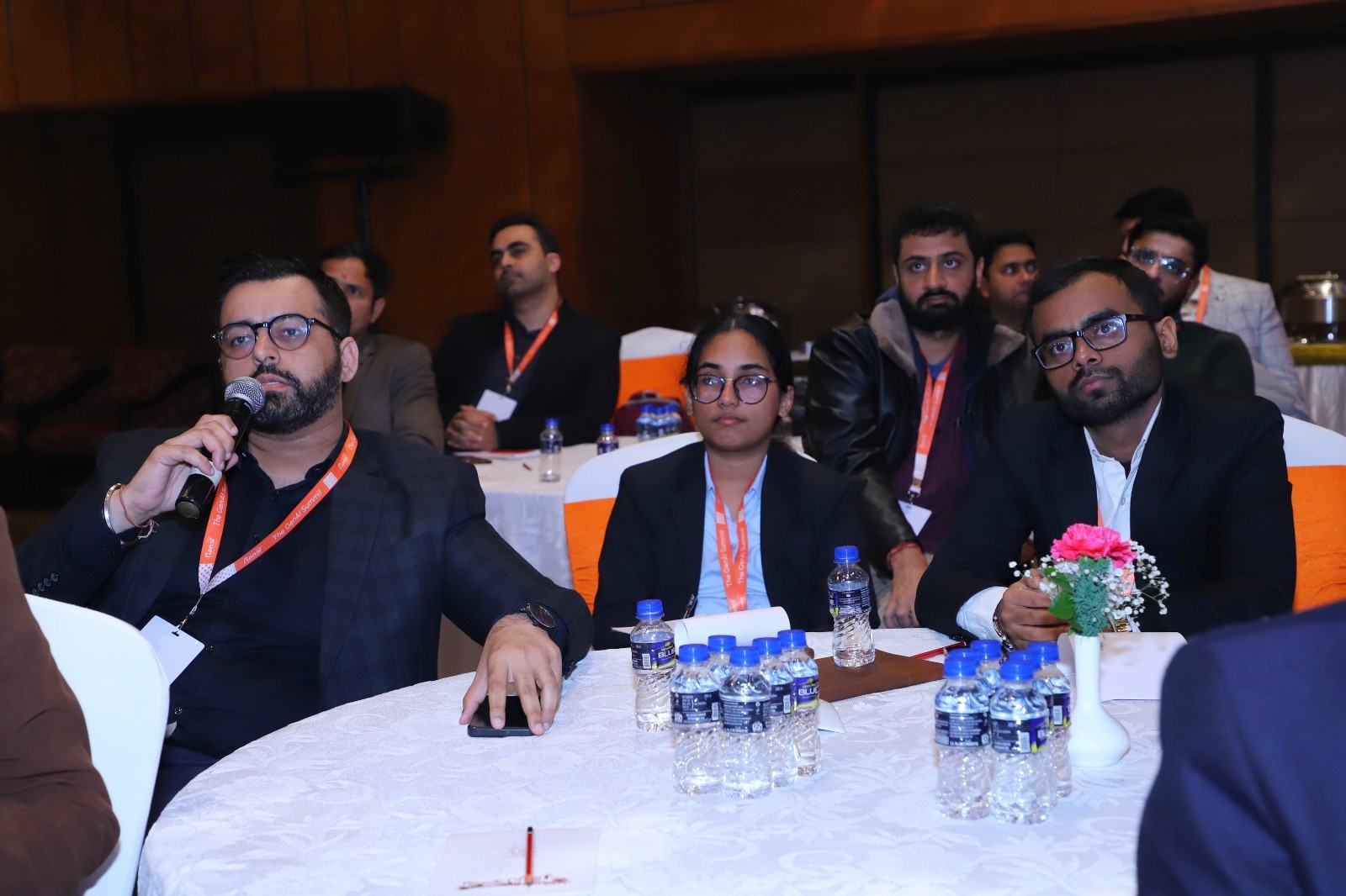 Woman talking to a Man using Mic