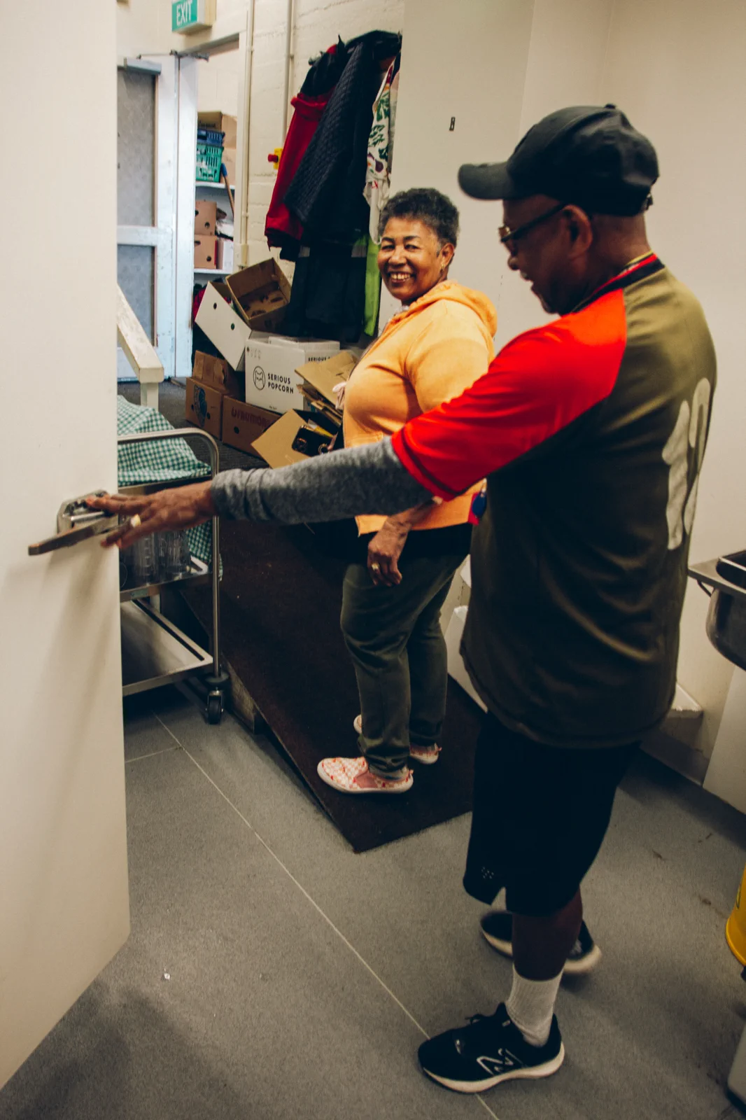 Two volunteers working in a commercial kitchen
