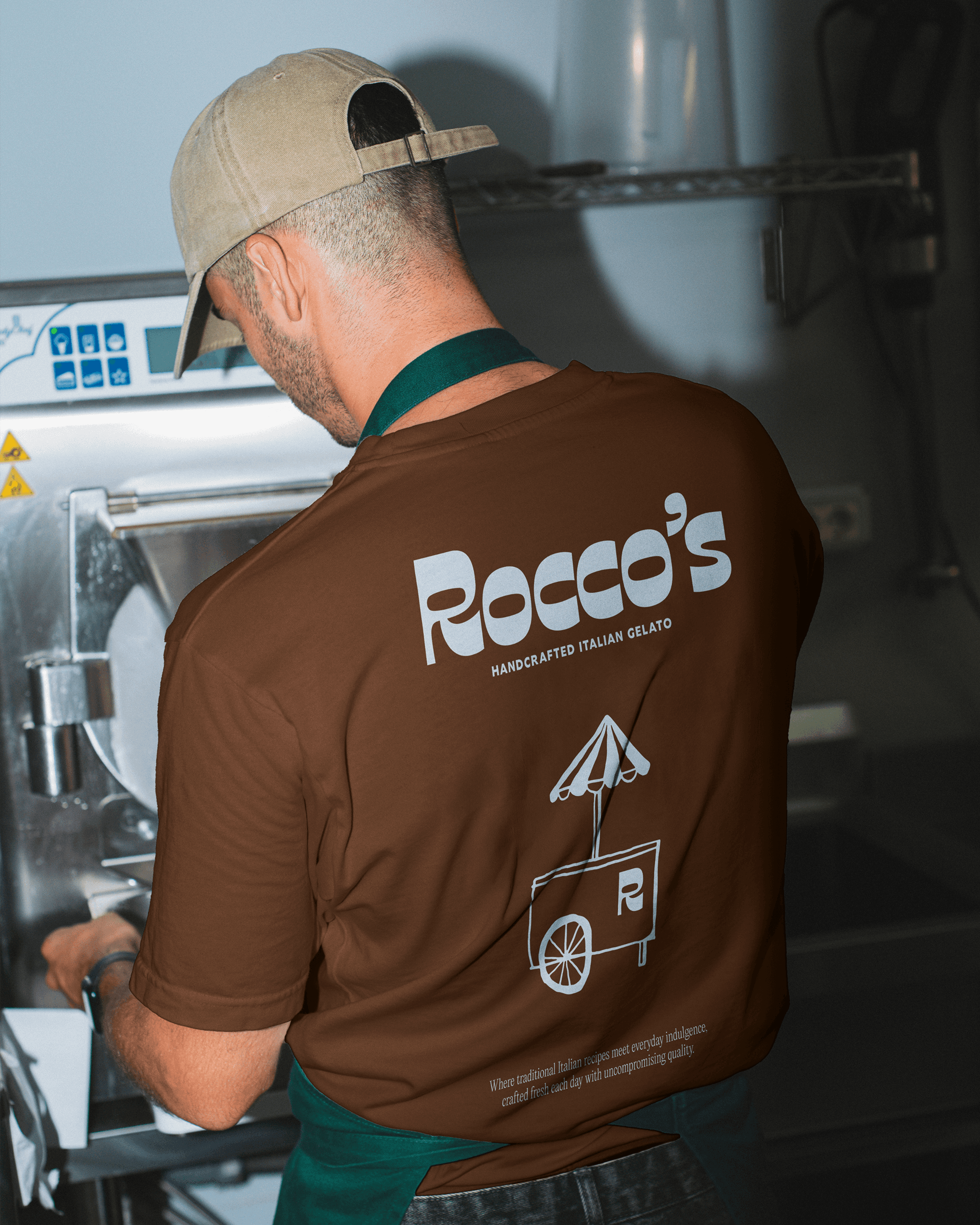 Paccos gelato maker wearing a branded brown shirt