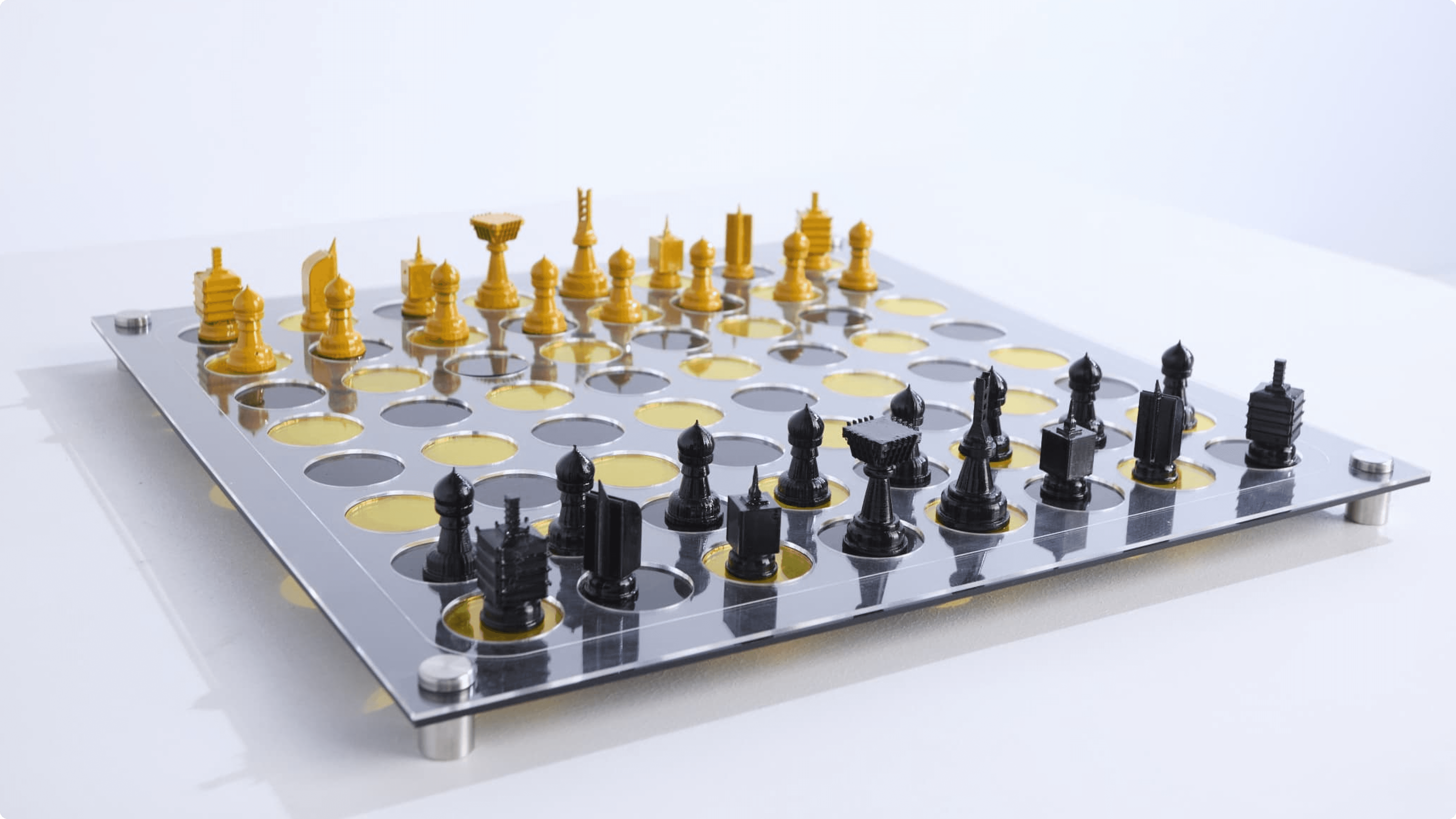 Two square yellow-ochre exhibition catalogues stacked on a pale grey surface, one titled “the power of paint” and both stamped “AVANT GALLERY” at the corner.