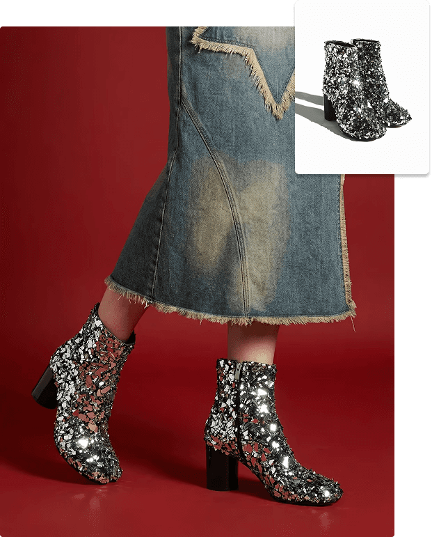 A person stands against a plain white background wearing a black baseball cap, a white oversized T-shirt, black pants, and white sneakers, exuding a casual fashion style.