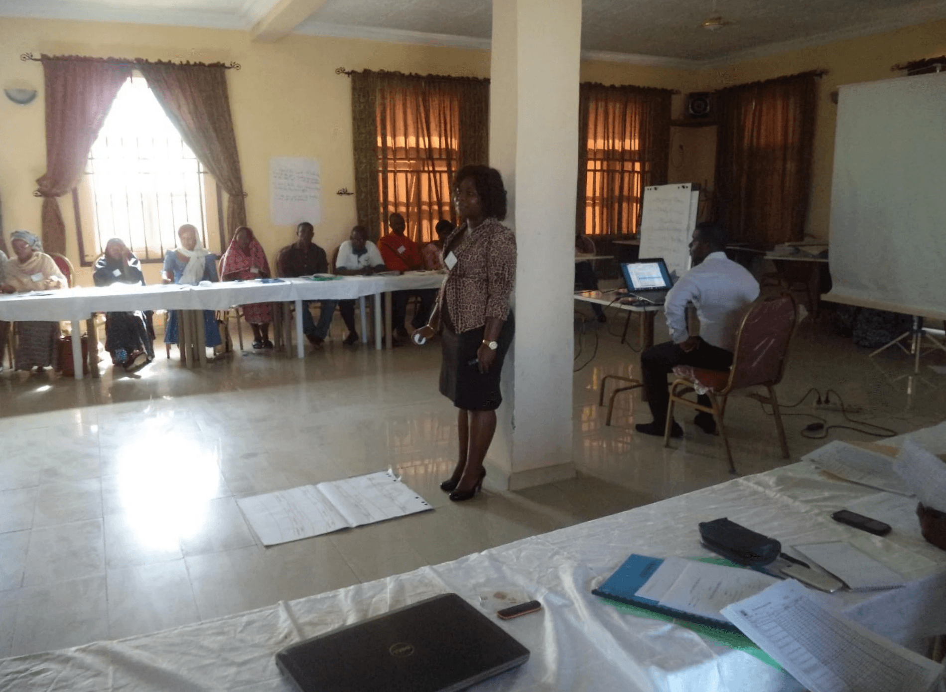 man in black crew neck t-shirt and blue shorts holding woman in white and red