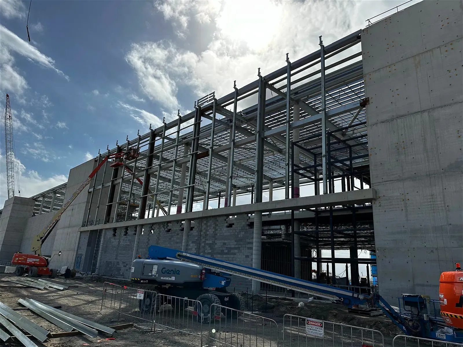 Construction site with steel framing and concrete wall