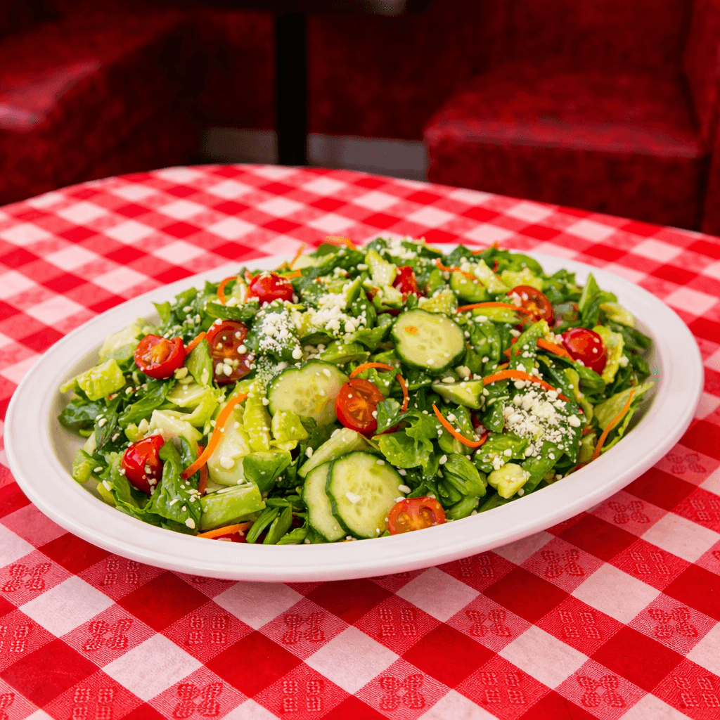 A bowl of salad with boiled eggs and fresh vegetables