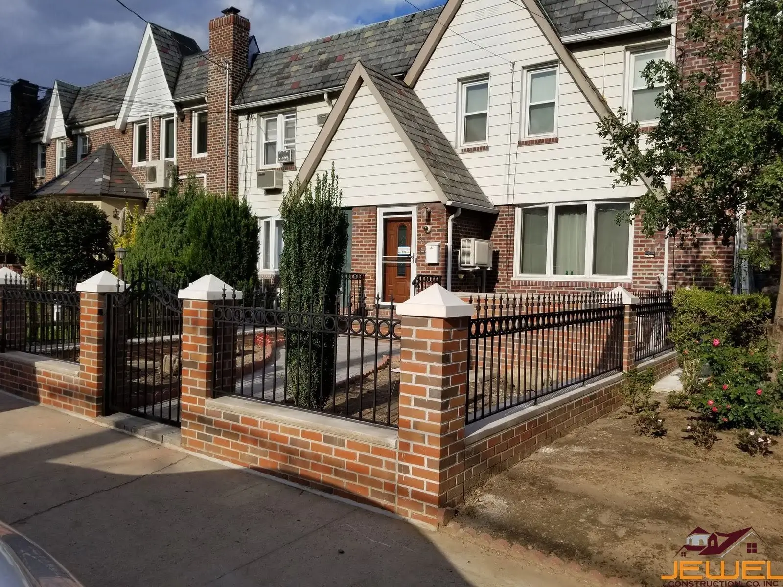 Custom brickwork with Capping Lime stone and custom iron fence for school completed by Jewel Construction in Queens, NYC