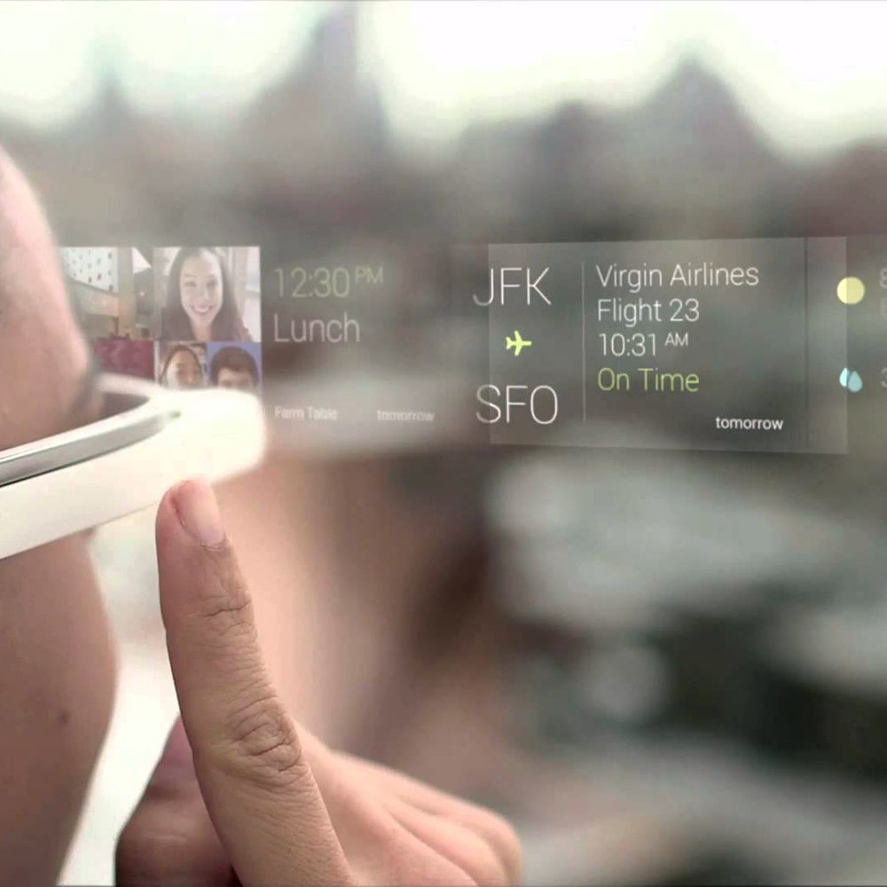 A close-up point-of-view shot of someone interacting with an Google Glass with UI superimposed mid-air.