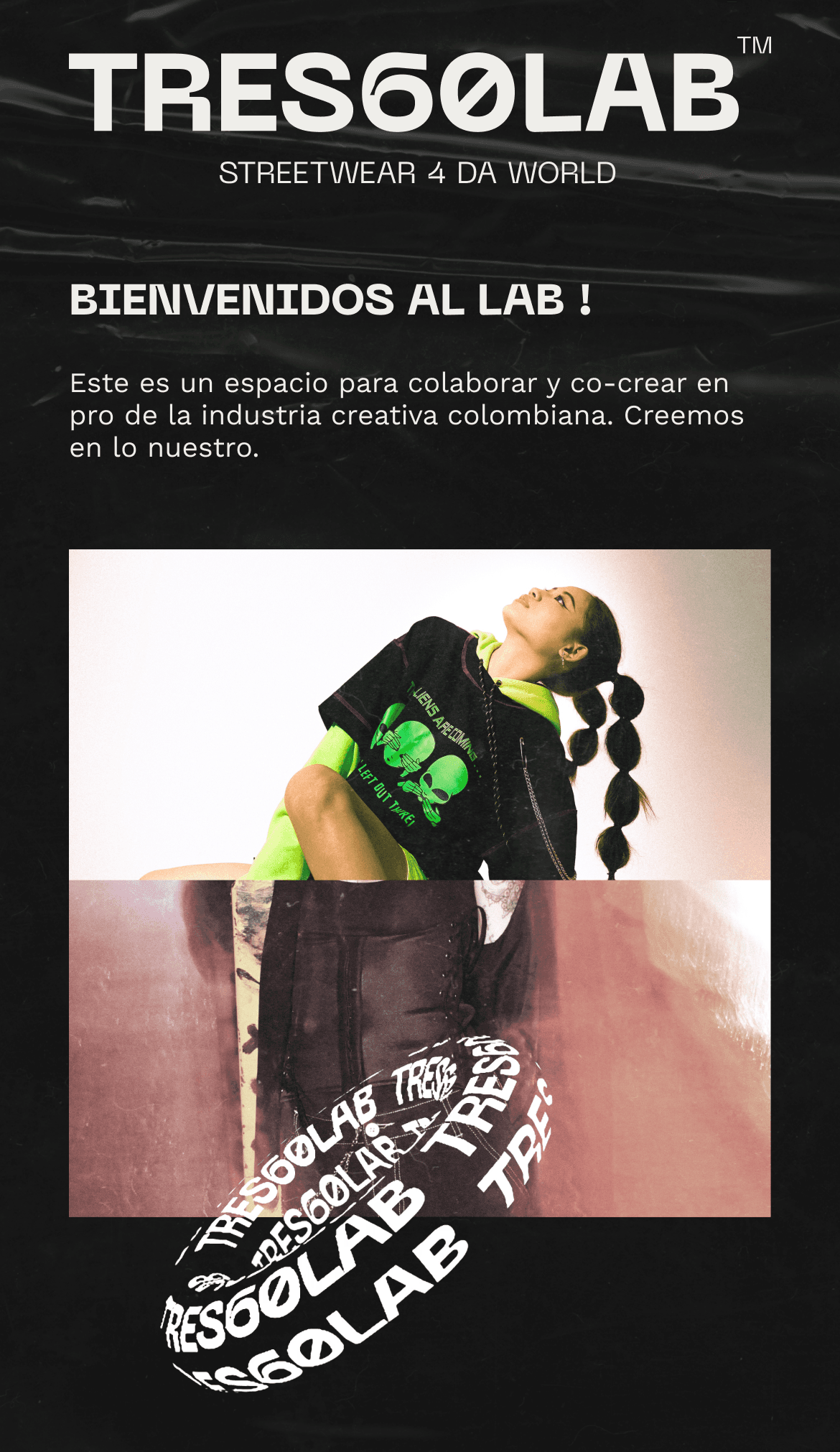 A close-up of a hand wearing multiple decorative rings against a blue background.