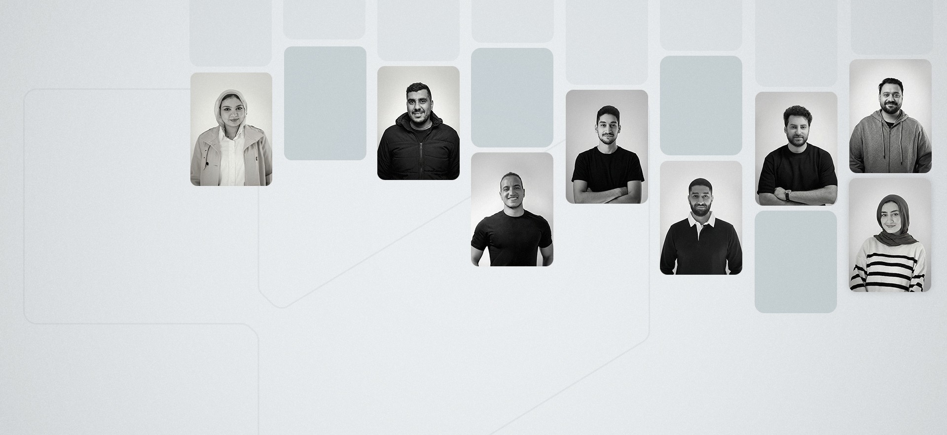 Three people sitting on a couch in a room looking at mobile devices