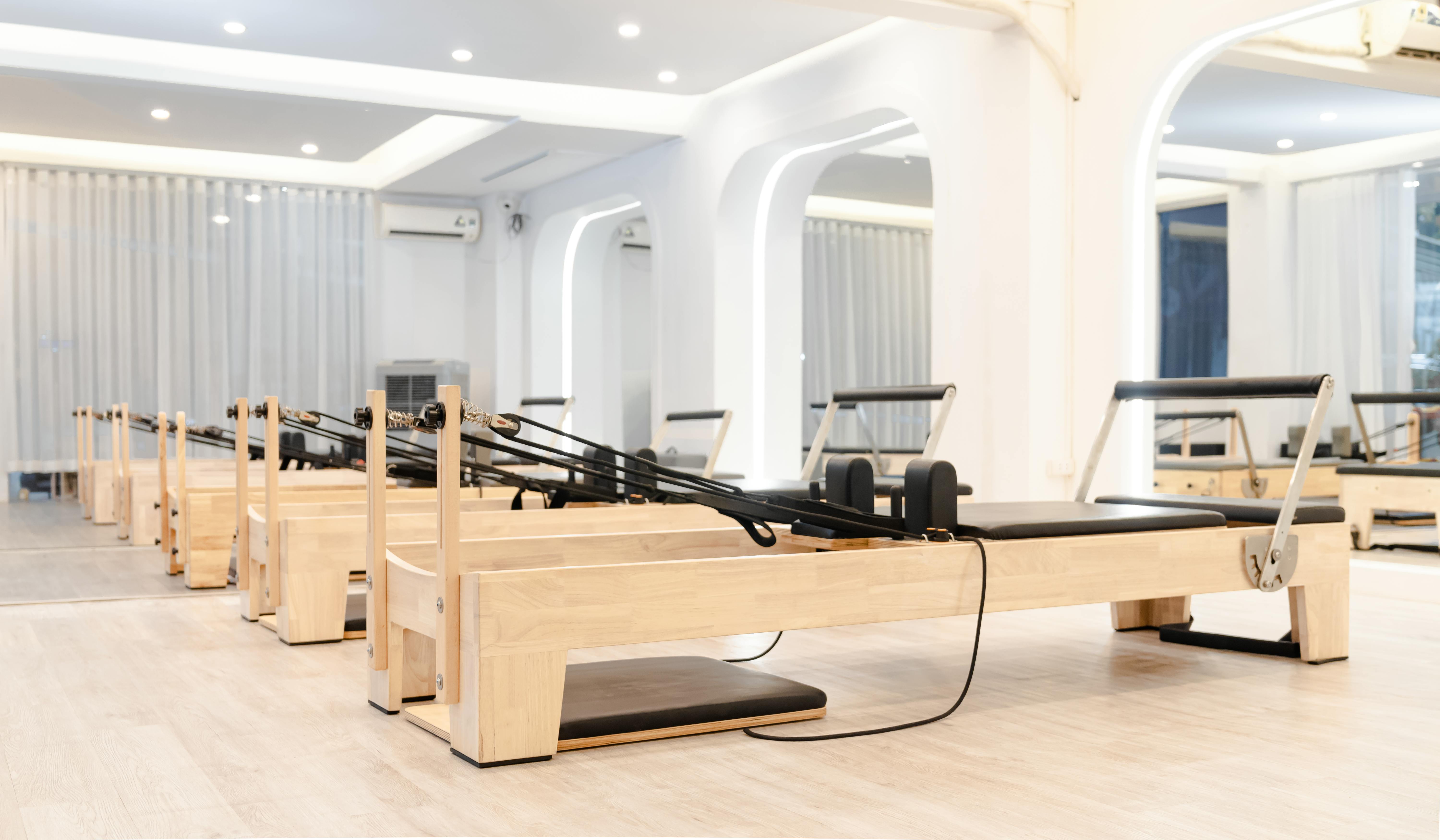 A boutiqe fitness club with reformer pilates machines.