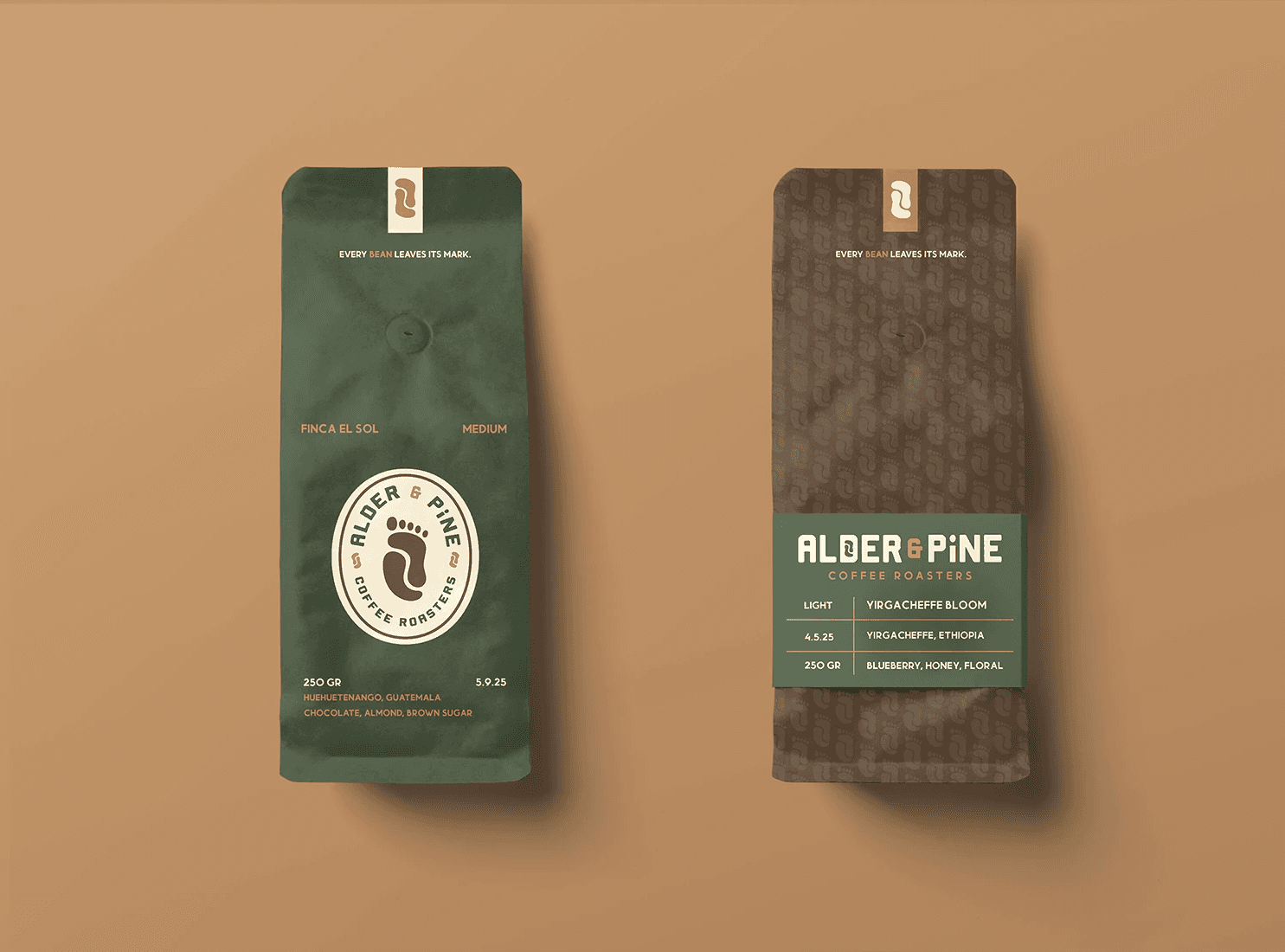 Graphic design mockup of a coffee bean bag for Alder & Pine Coffee Roasters — modern, clean wordmark and badge style logo of a footprint and a coffee bean with a bold decorative sans serif typography, designed by Will Lefkovich.