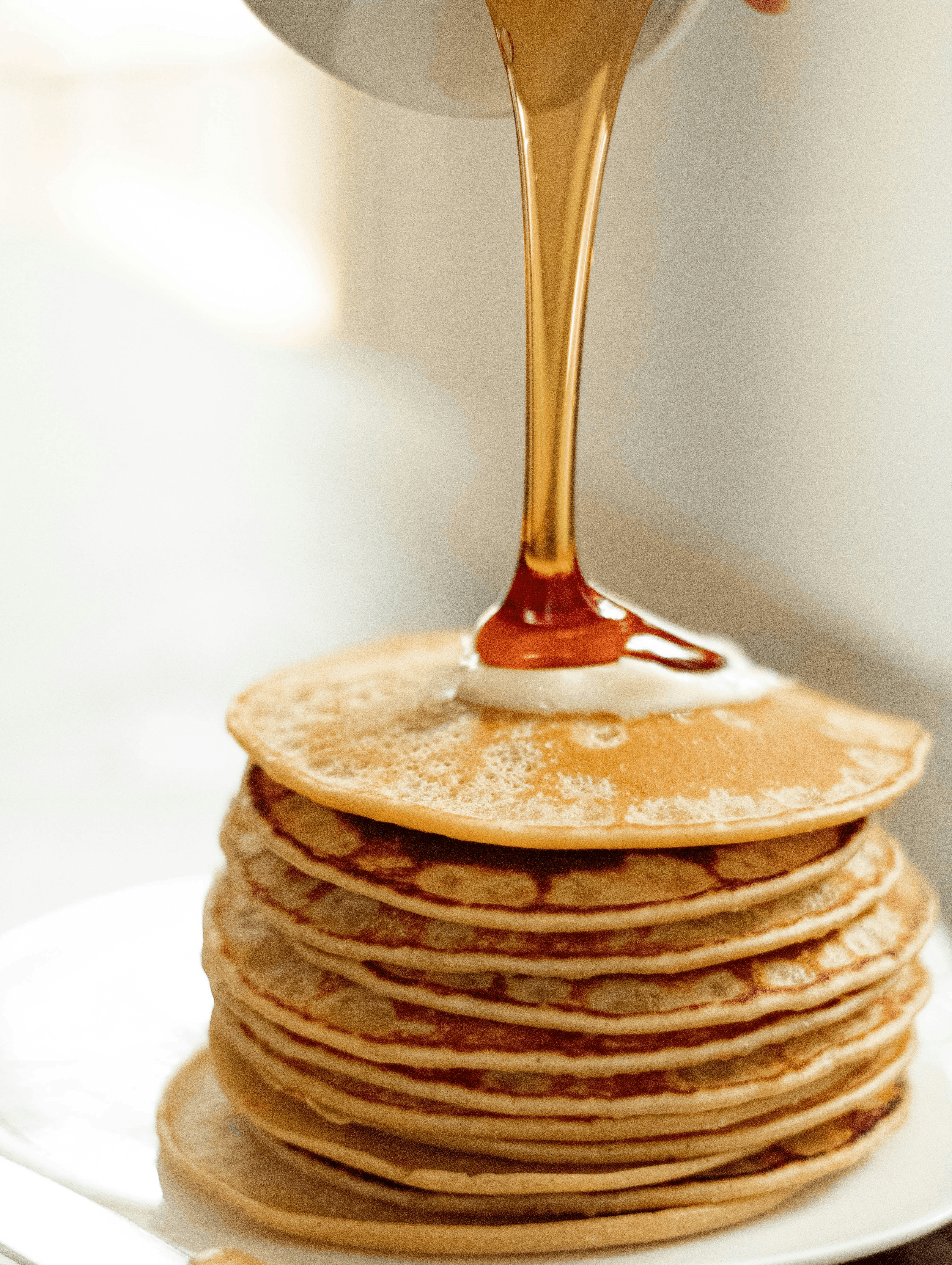 brown pancakes on white ceramic plate