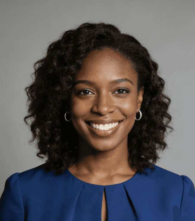 A professional portrait of a smiling woman