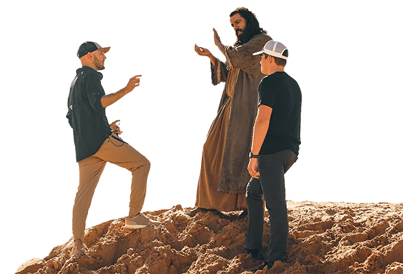 Mitch Hudson and Richie Johns talk to Moses on the set of The Promised Land Series
