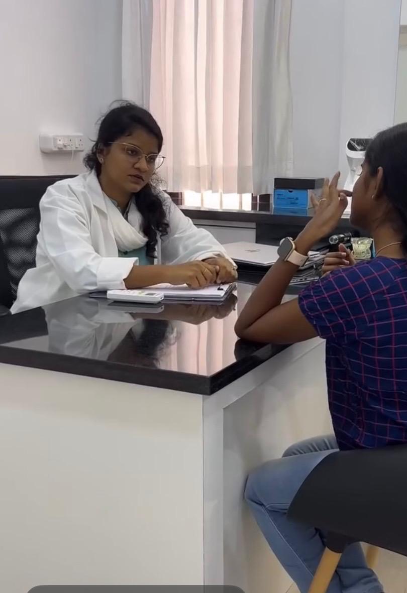 Close-up of freckled face with rose and glossy lips