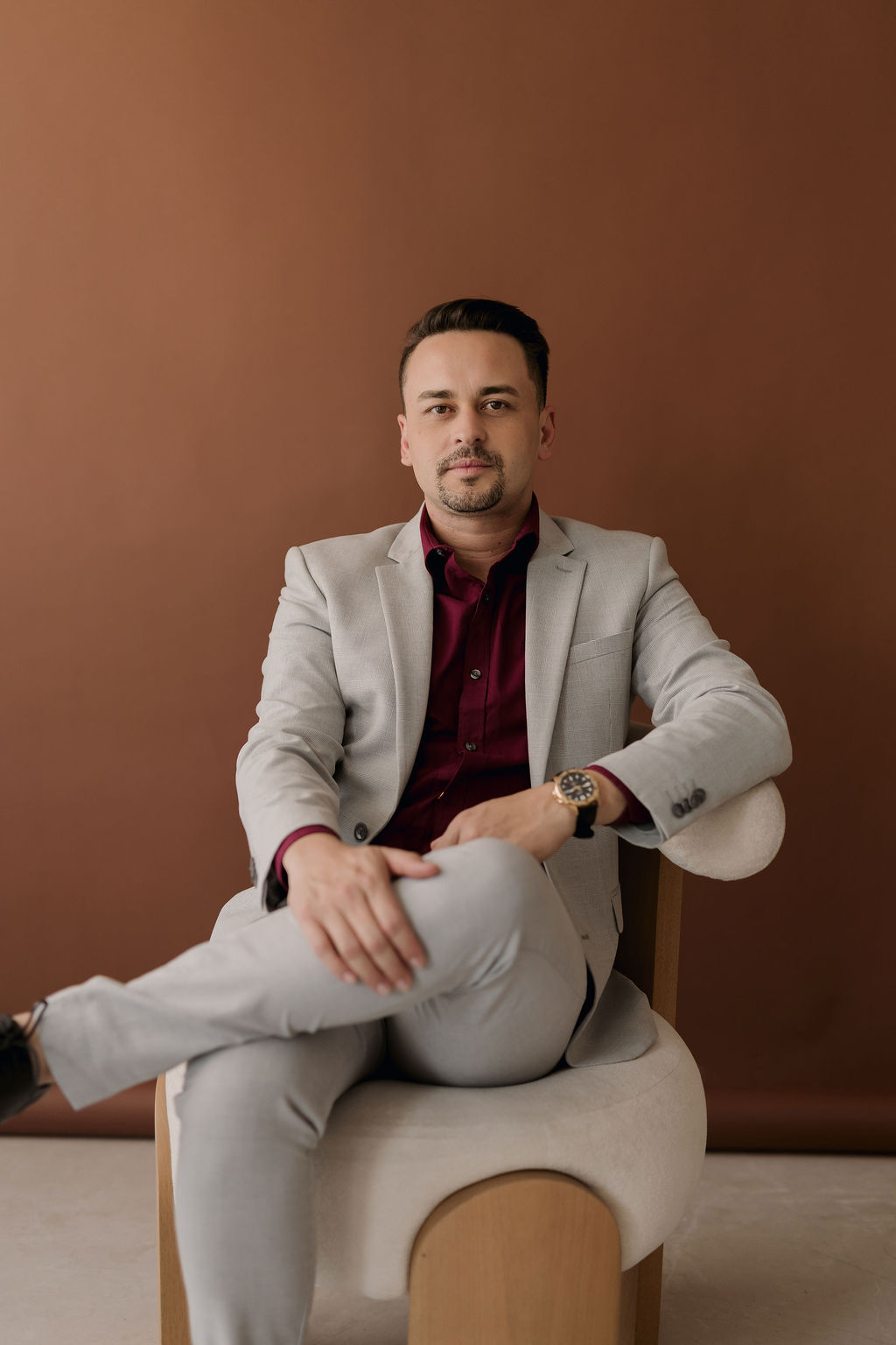 a man in a suit with neutral background