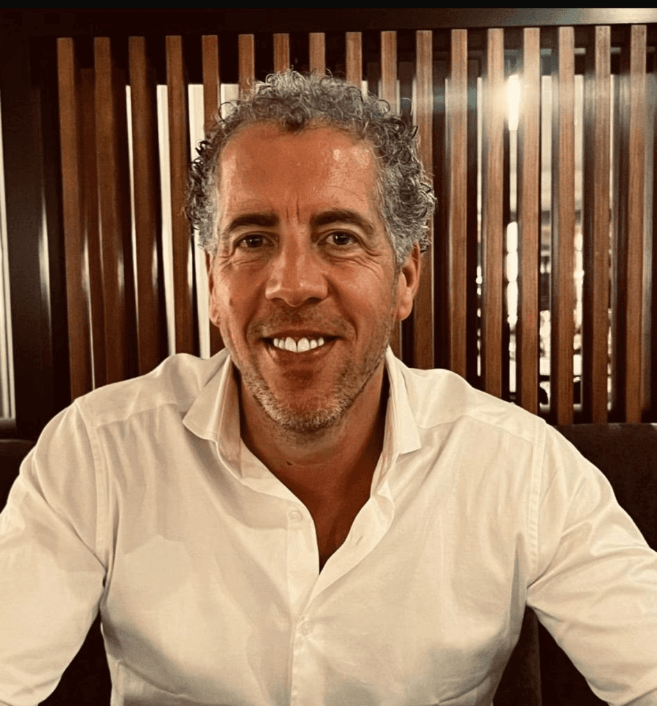 picture of a man in a white shirt smiling