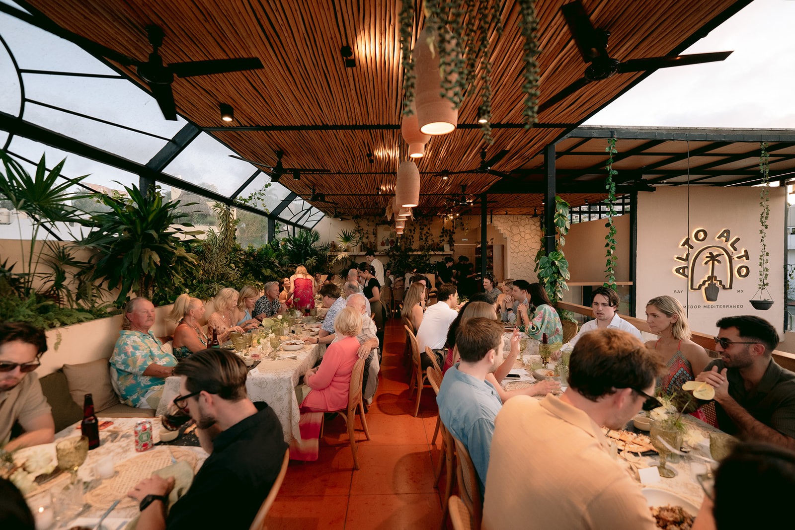 an interior of a fine dining restaurant with focused shot on the table with the plates and glass has been served