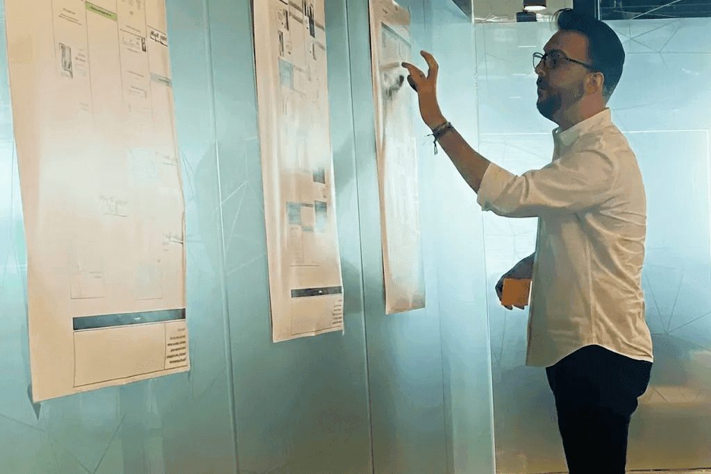 Javi Calderon mapping ideas on a research wall