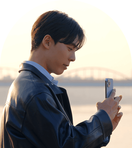 African man smiling on phone