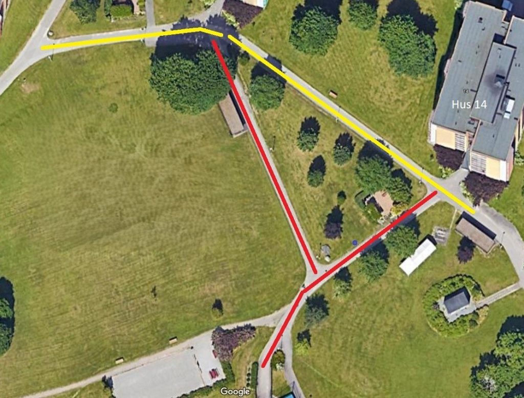 red and white house surround green grass field