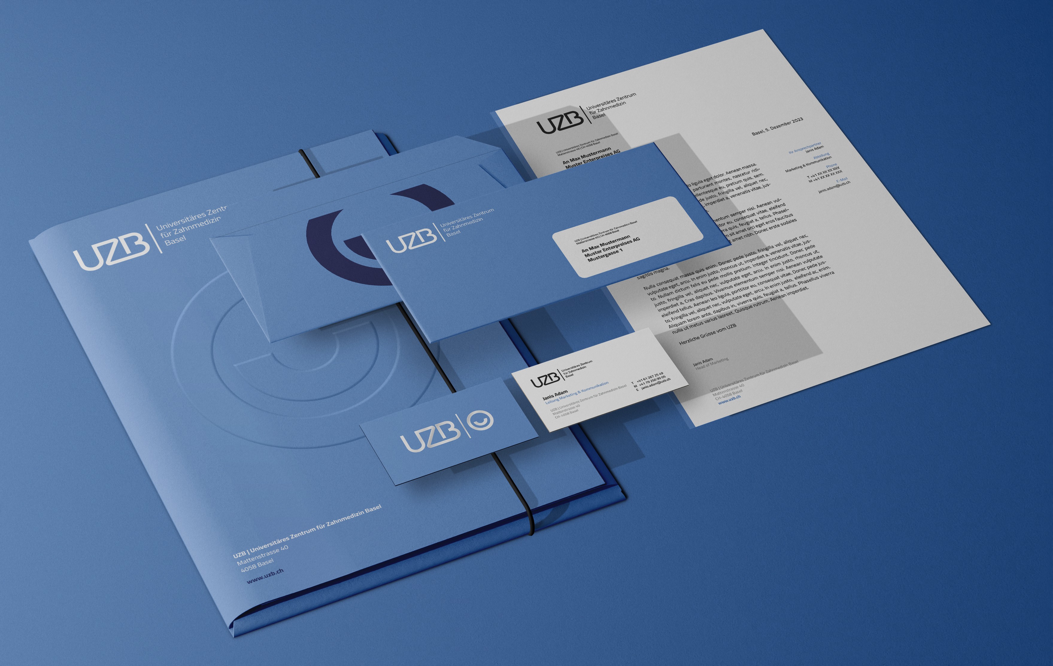 Geschäftsausstattung für die UZB Basel – Briefpapier, Visitenkarten und Formulare im neuen Corporate Design.