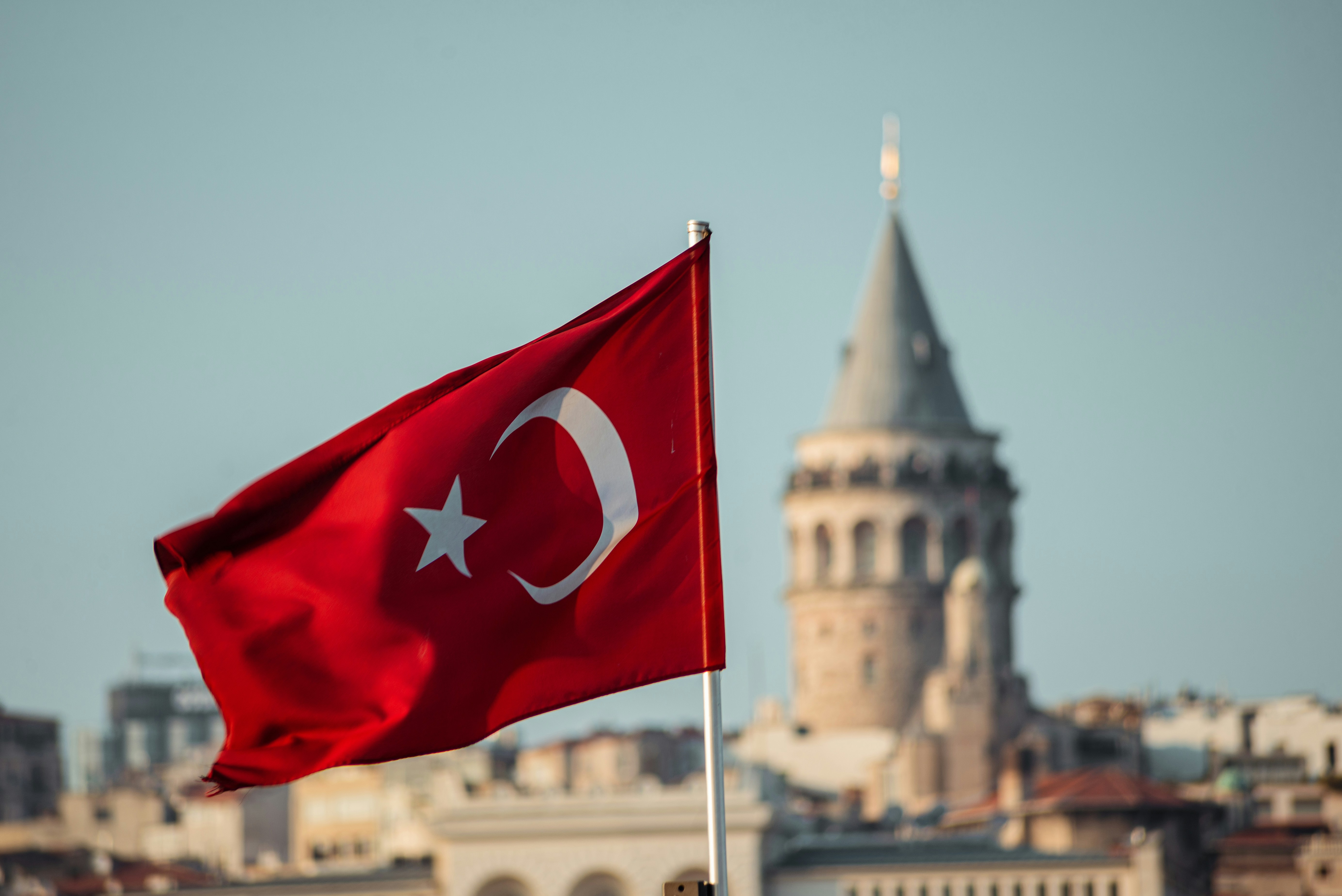 Turkish flag overlooking Fethiye, representing the legal framework for family residence permits in Turkey