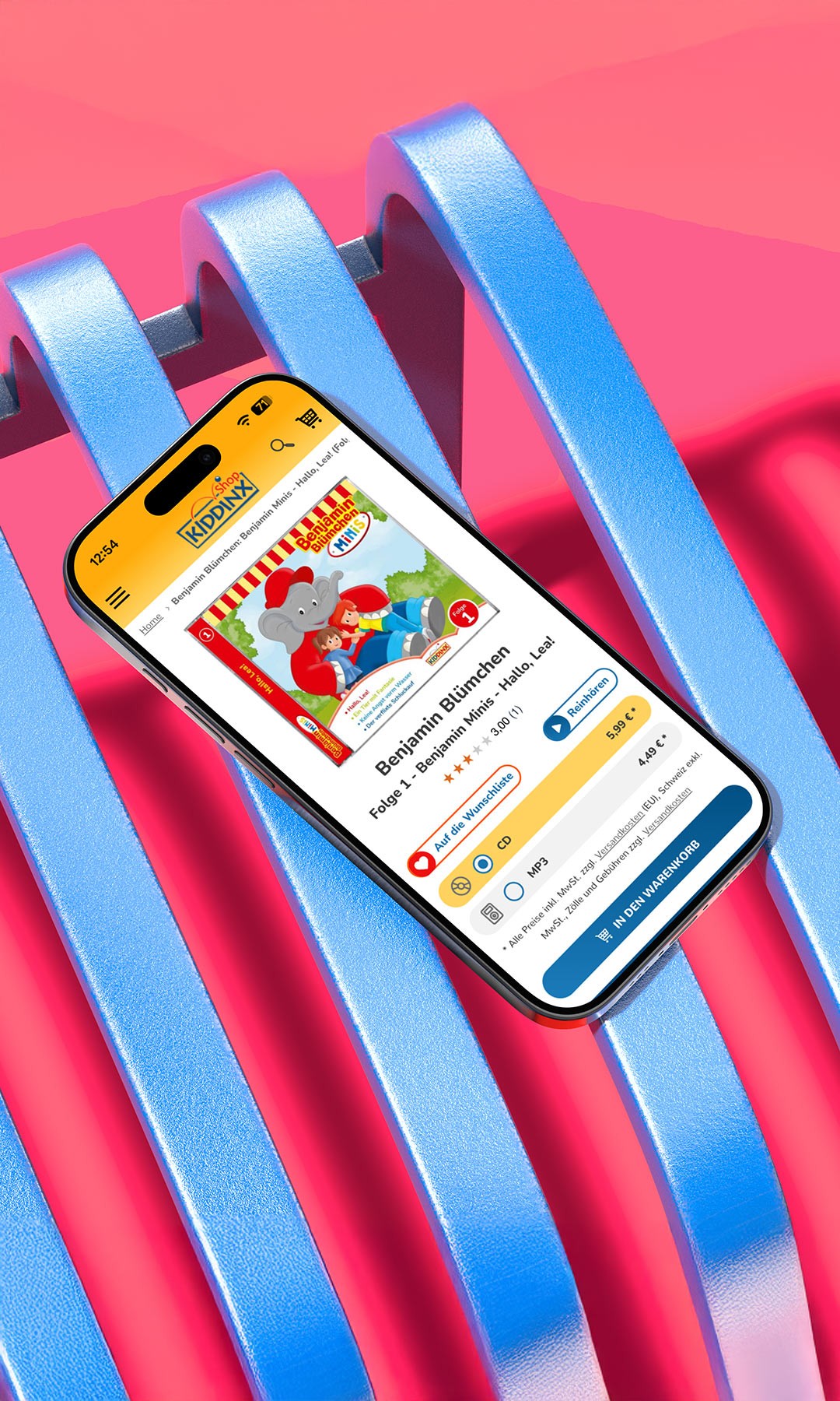 Smartphone mit geöffneter Kiddinx-App liegt auf pinkem Hintergrund mit blauen Streifen. Auf dem Bildschirm sind bunte Kinderinhalte zu sehen.
