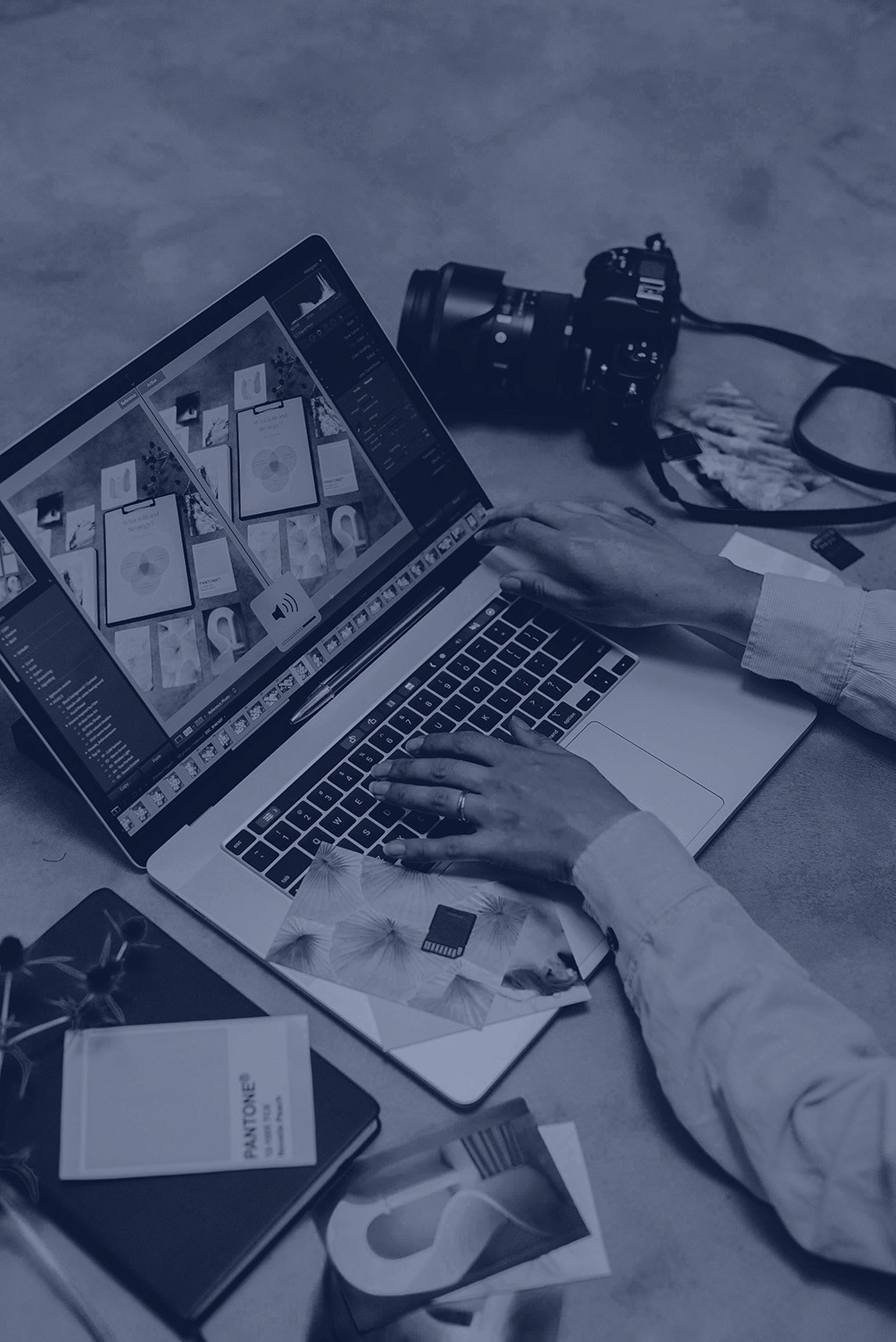 Conceptual artwork of a lone figure standing in a field of clocks, exploring time and reflection.