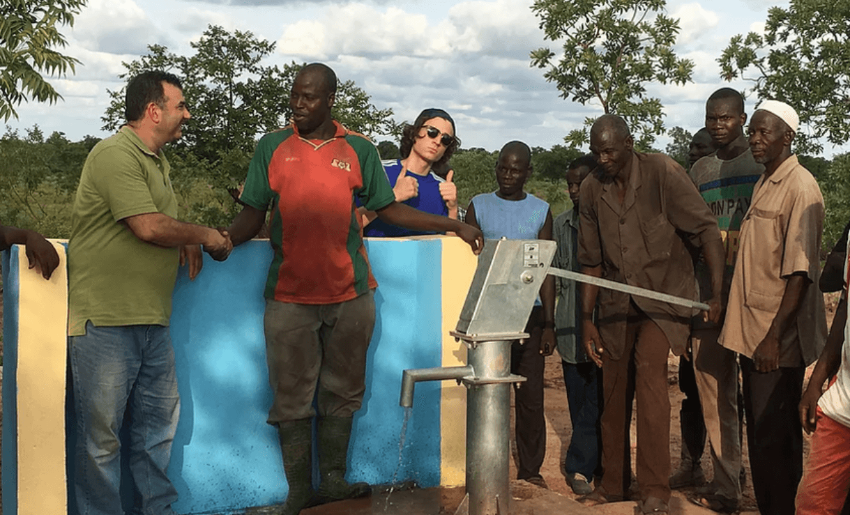 woman in black blazer smiling