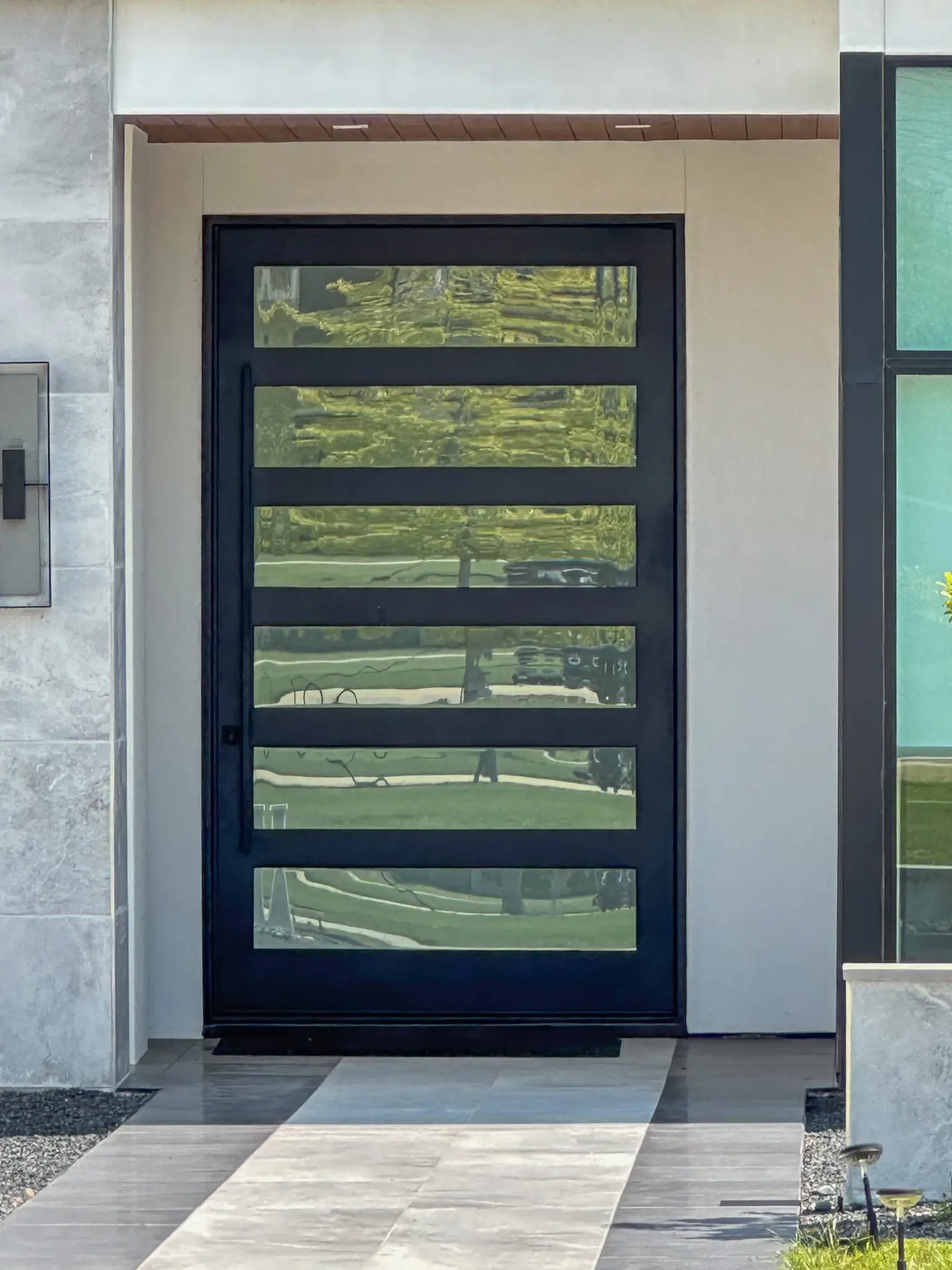 6 lite iron pivot door installed by M2 Metals Iron Doors DFW