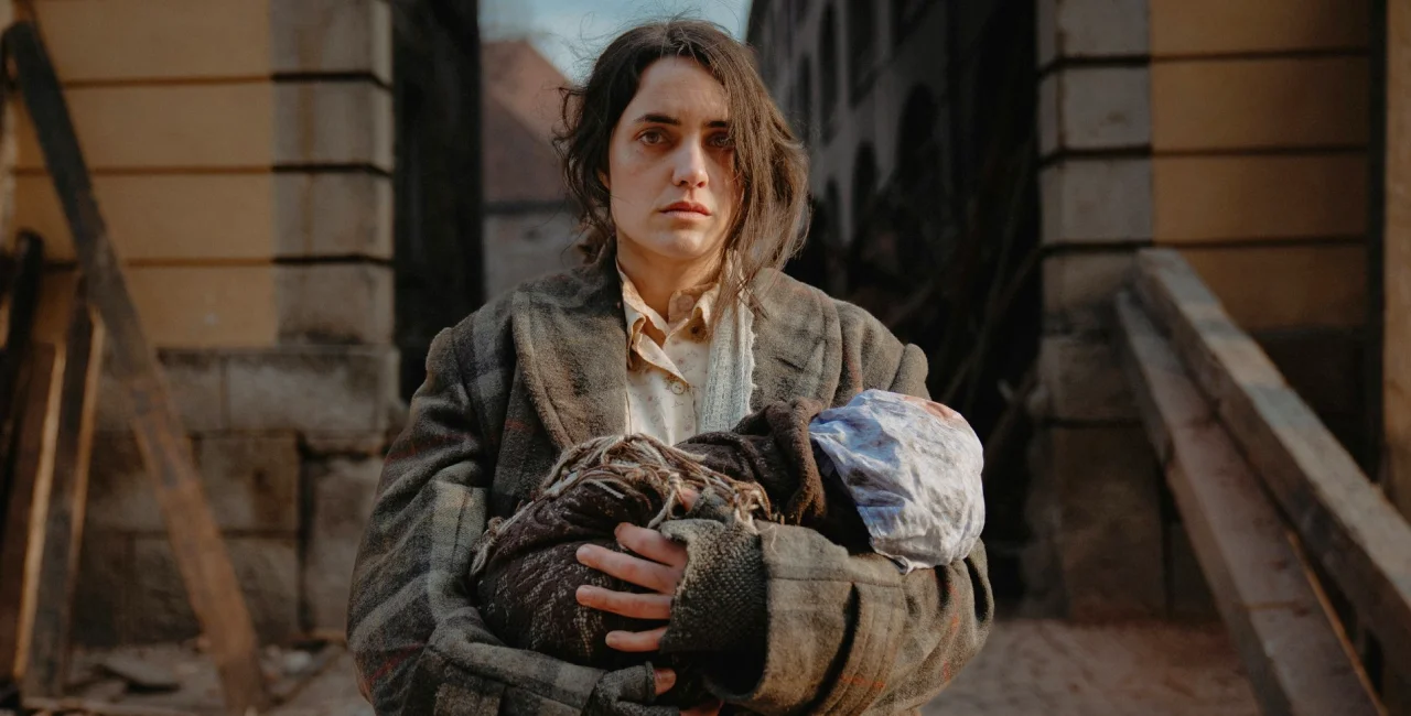 a lady holding a baby