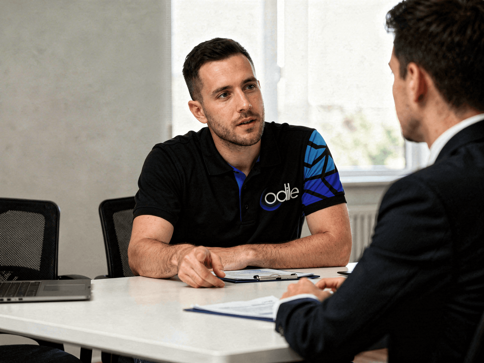 people sitting on chair in front of laptop computers
