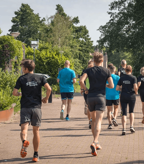 Snowboarder enjoys a downhill run on a sunny day.