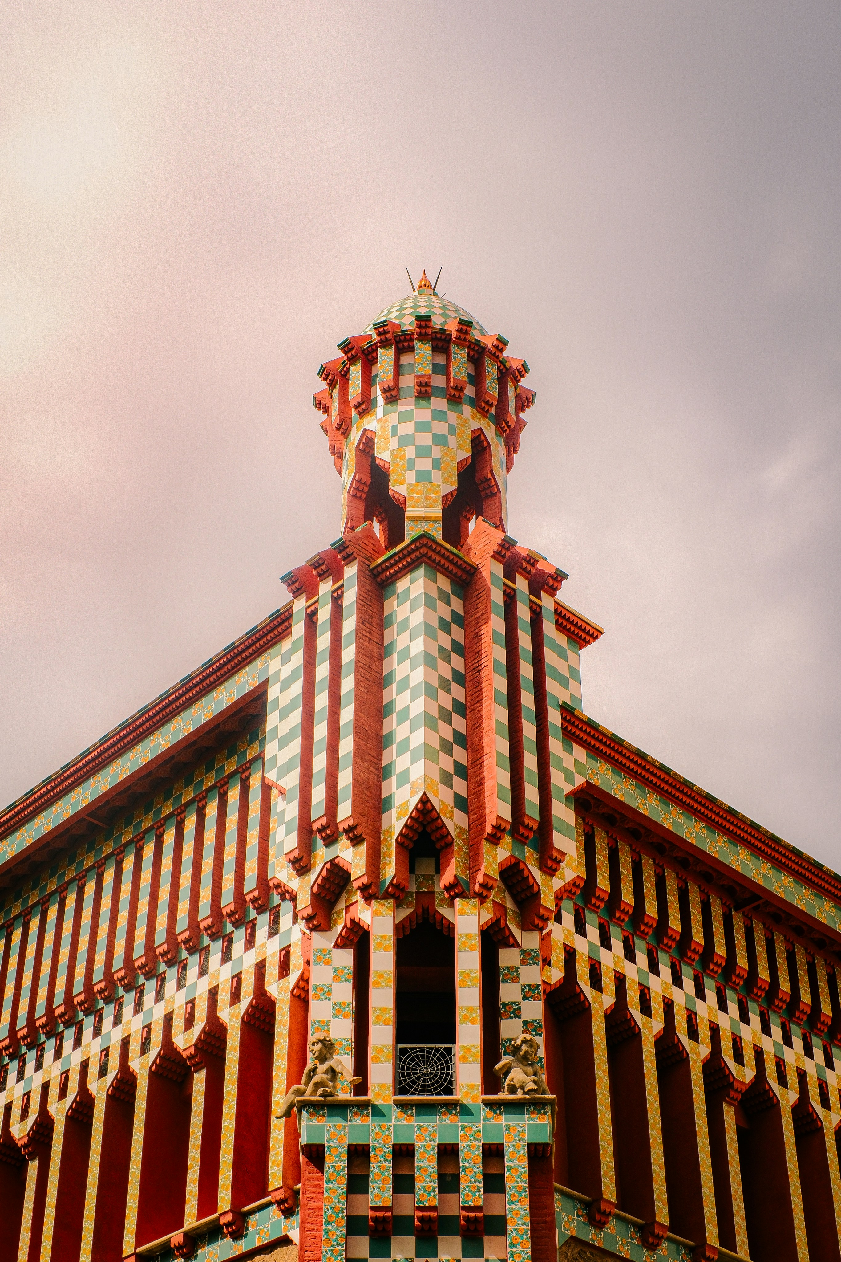 The colorful checkered facade and tower of Casa Vicens in Barcelona.