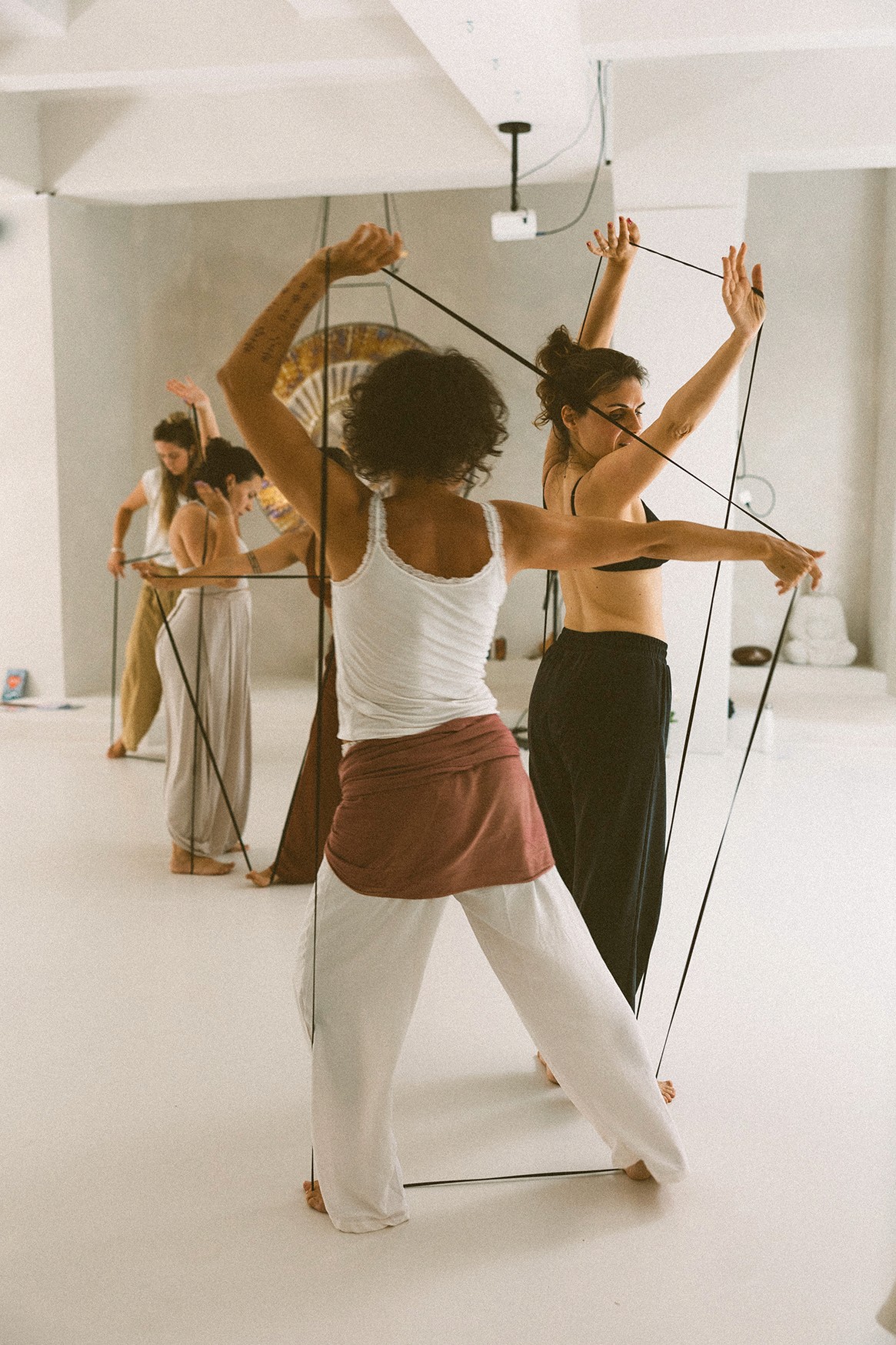 An orange cube-shaped side table is shown.