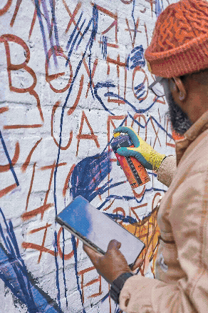 Photographer directing model in a studio setting