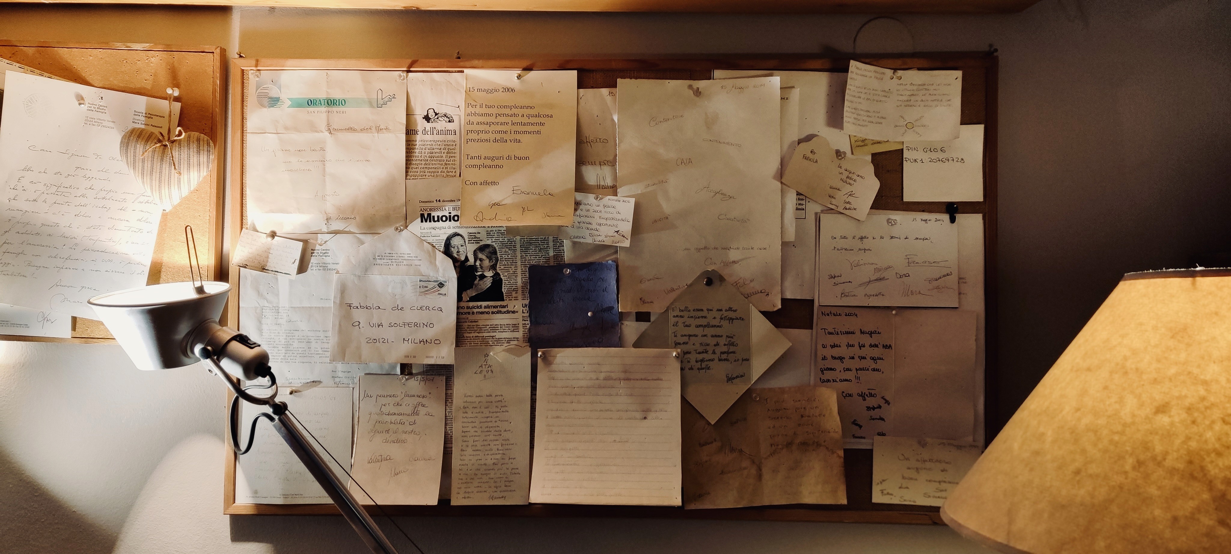 three people sitting in front of table laughing together
