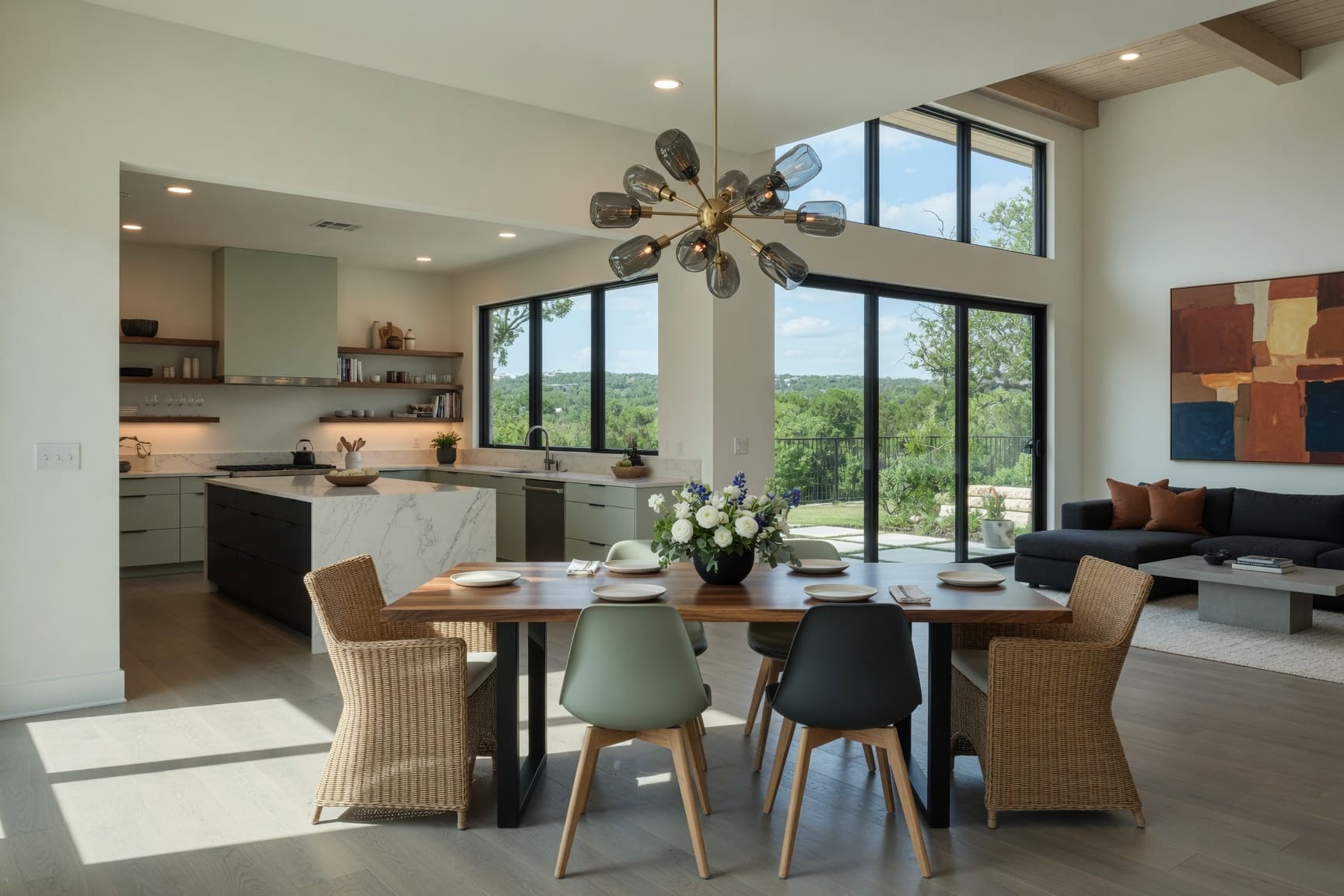 Dining room with sculptural chandelier and floor-to-ceiling windows