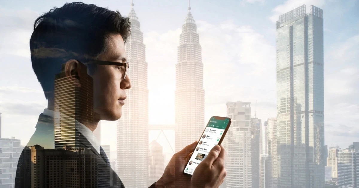 Malaysian SME owner managing business on WhatsApp on their mobile phone