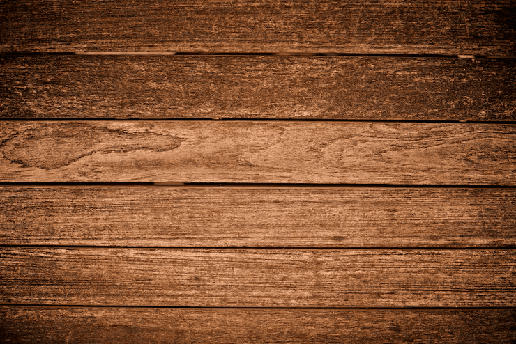 Close-up of a green palm leaf with intricate veining and texture, showcasing rich shades of green.