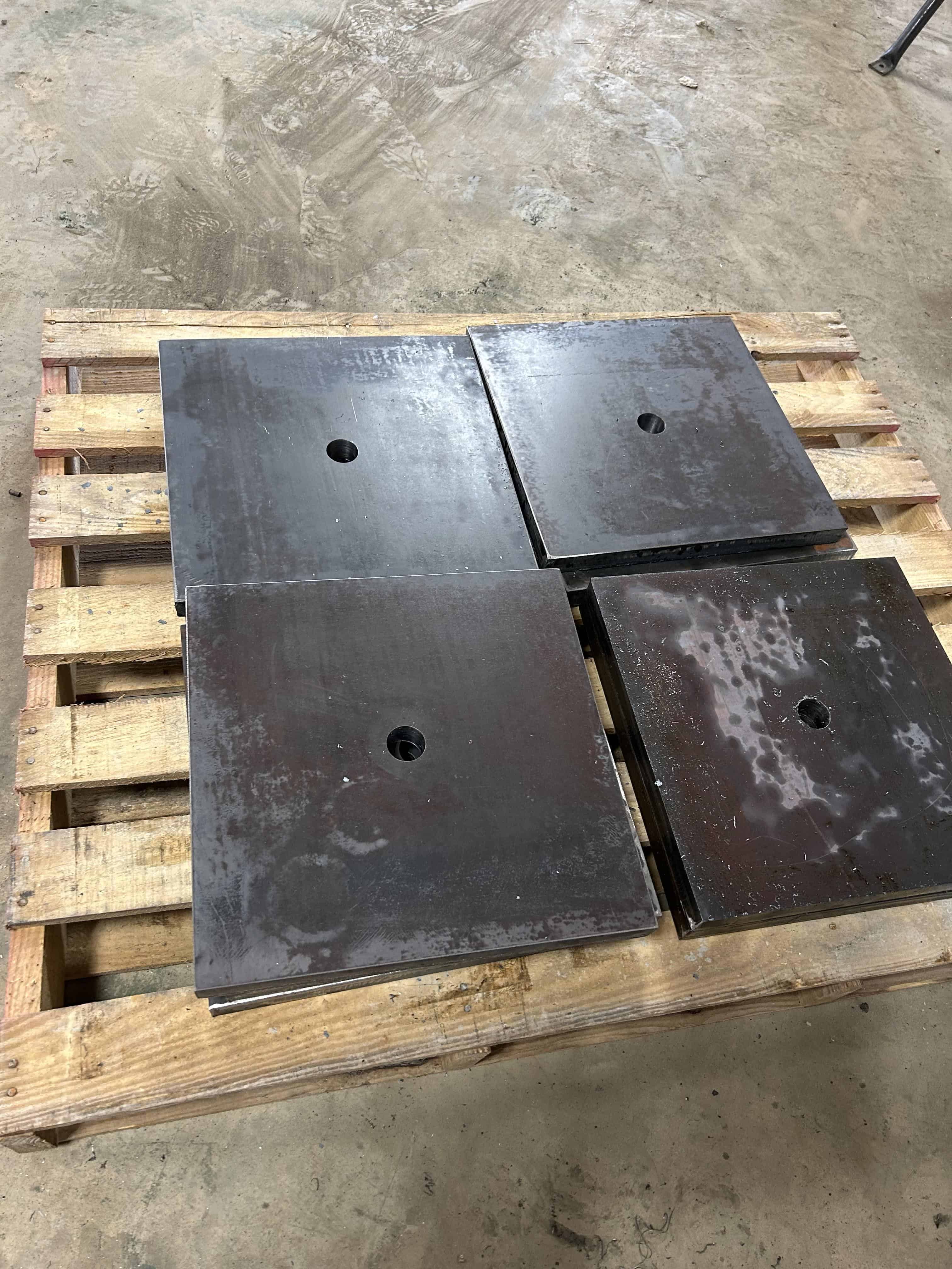 Thick steel plates on a pallet that we cut with our Victor track torch and drilled with our mag drill.  Custom pieces for a customer in a bind for a project in Henderson, Texas.