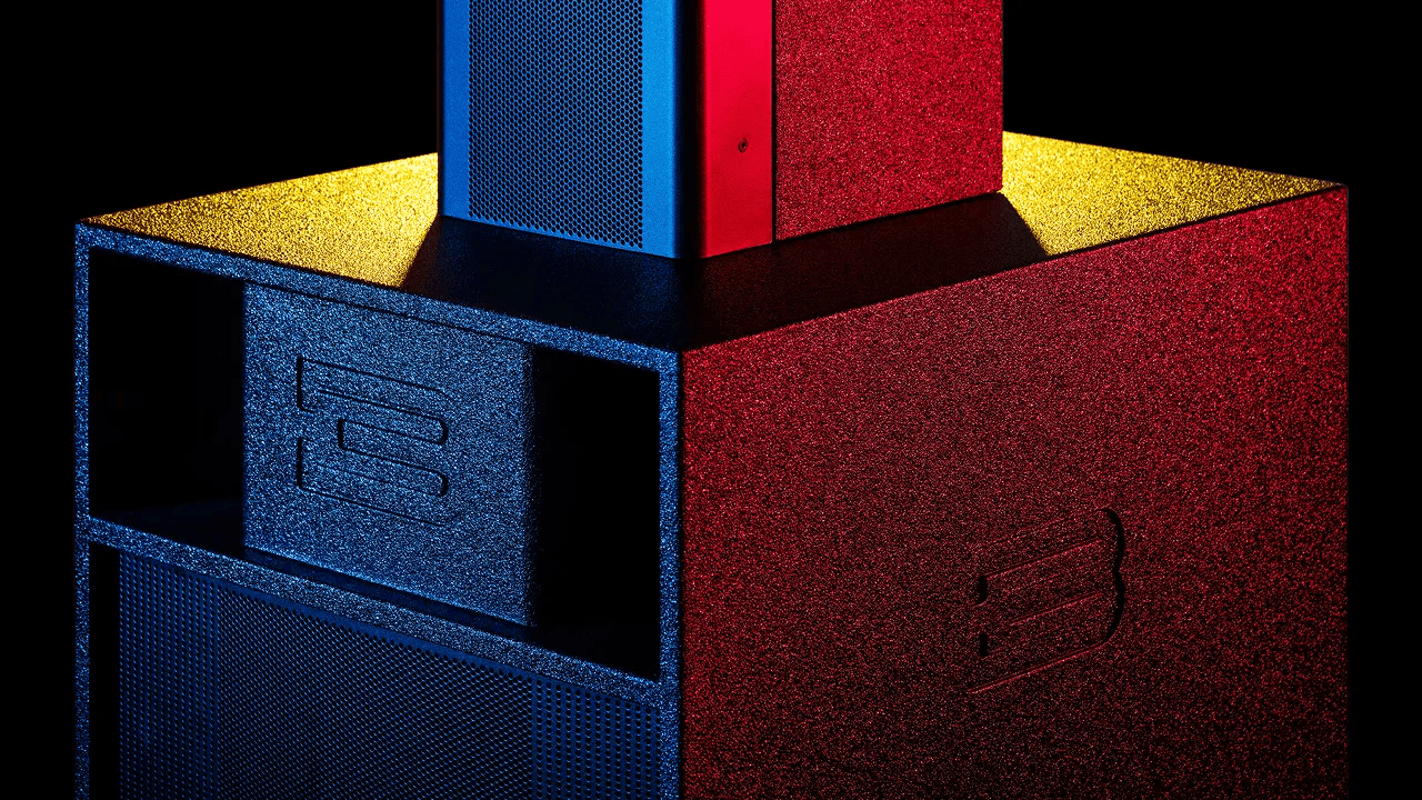 Speakers with blue, red, and yellow lighting.
